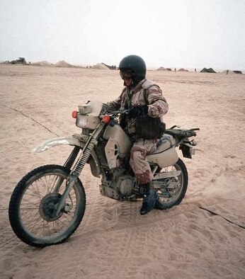 An American military member readies his motorcycle for operations in the deserts of Southwest Asia during the first Gulf War. The motorcycle has a distinct military heritage, which began in World War I and continues today. The protective leather gear worn by Airmen in the hostile skies in World War II was the same type of clothing returning servicemembers donned when America’s fledgling motorcycle clubs were started by many returning veterans. (Courtesy photo)
