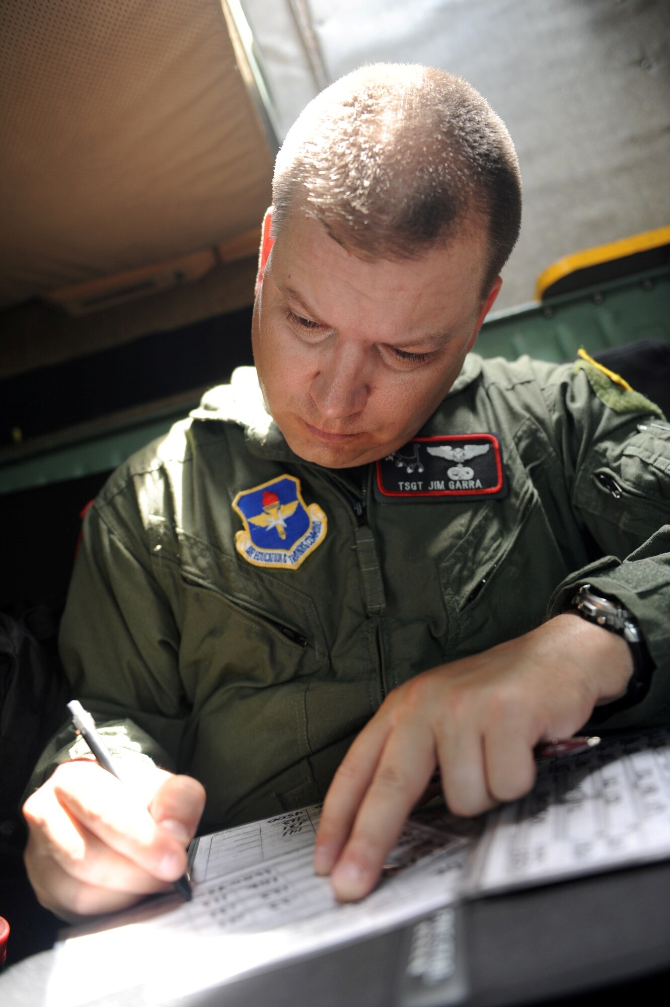 Tech. Sgt. James Gara, 62nd Airlift Squadron, flight engineer prepares to take off in support of a flyover for the repatriated remains of Chief Master Sgt. John Quincy Adam.  Chief Adam's remains were laid to rest at a funeral service held in Kansas City, Kan.  Chief Adam is a Vietnam War veteran who was Missing In Action for more than 40 years. Chief Adam’s remains were discovered in Southeast Asia and he was finally brought home to be laid to rest, giving his family closure in their lives. (U.S. Air Force photo by Senior Airman Jim Araos.)