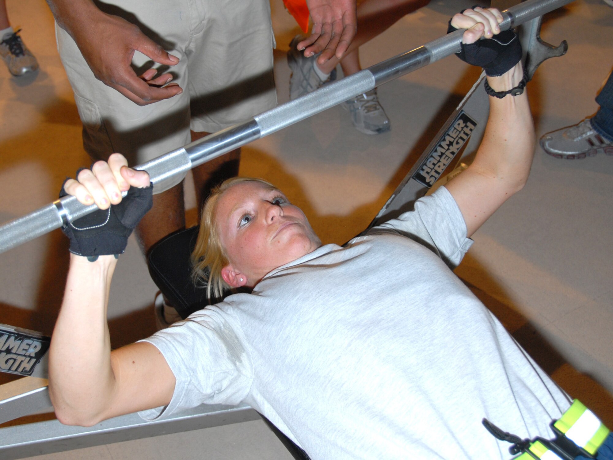 Staff Sgt. Shannon Weir, 379th Expeditionary Logistics Readiness Squadron supply technician, participates in the bench press event here, July 29, as part of the base-wide Commander's Cup competition.  Sergeant Weir is a native of Rock Tavern, N.Y., and is deployed from the New York Air National Guard in support of Operations Iraqi and Enduring Freedom.  (U.S. Air Force Photo/Tech. Sgt. Jason W. Edwards)  