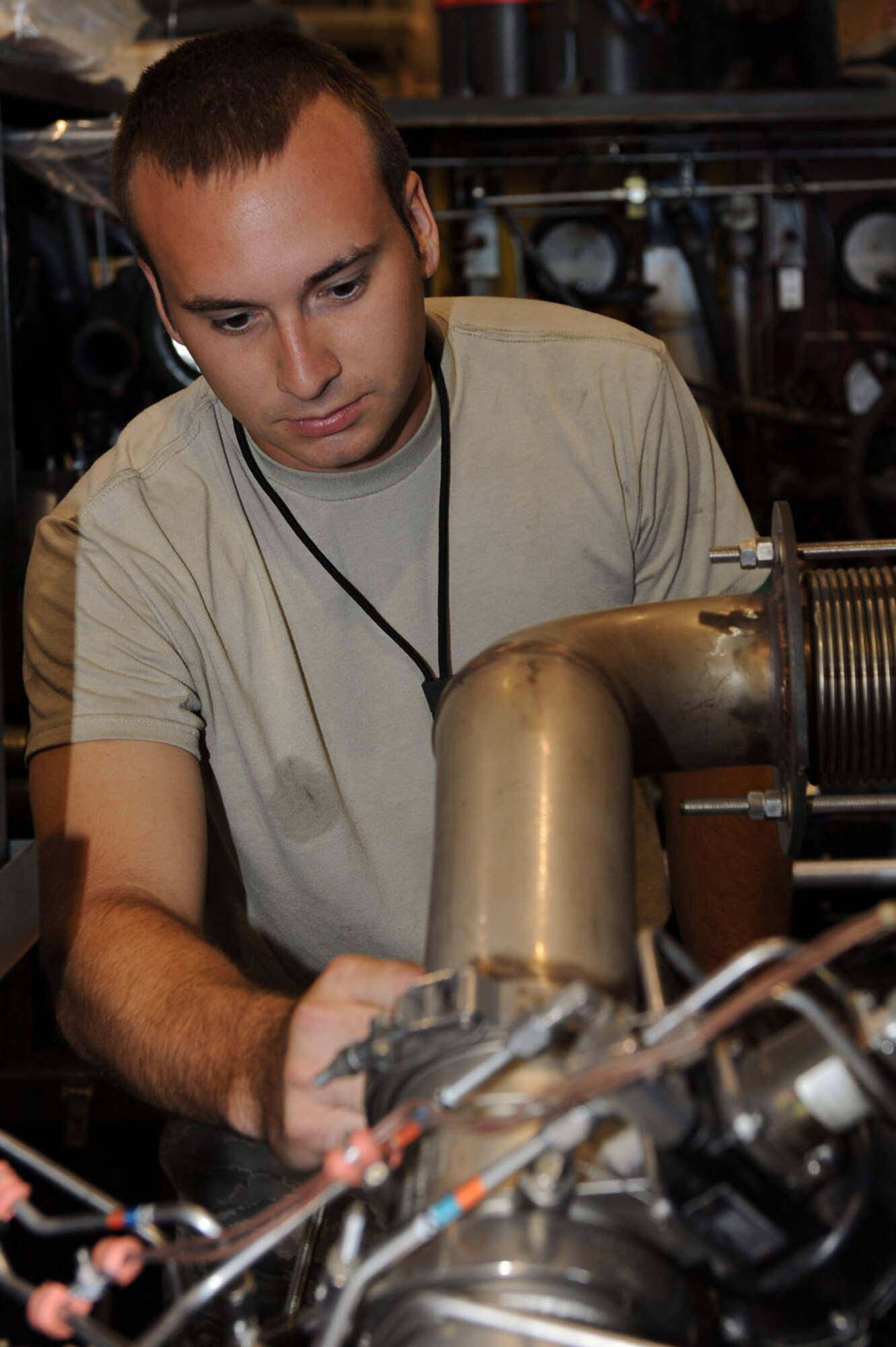 WHITEMAN AIR FORCE BASE, Mo. - Senior Airman Christopher Dewitt, 509th Maintenance Squadron Aerospace Ground Equipment Journeyman, performs maintenance on a Dash-98, which provides high pressure air to the plan to start the engines. AGE mechanics perform anywhere between 40 to 60 hours of maintenance a week in support of the B-2 mission. (U.S. Air Force photo/ Senior Airman Jason Huddleston)