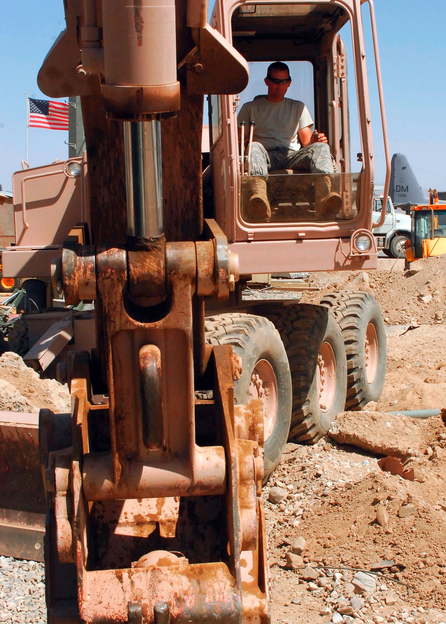 BAGRAM AIRFIELD, Afghanistan - Staff Sgt. Nick McCarthy, a heavy equipment operator from the 455th Expeditionary Civil Engineering Squadron, accomplishes the first step in clearing an area for new construction going on at Bagram Airfield. With more troops arriving here the need for more living and working areas is a priority for the 455th CES. Sergeant McCarthy is deployed from the 183rd Fighter Wing, Illinois Air National Guard and hails from Springfield, Ill. (U.S. Air Force photo/Senior Airman Felicia Juenke)