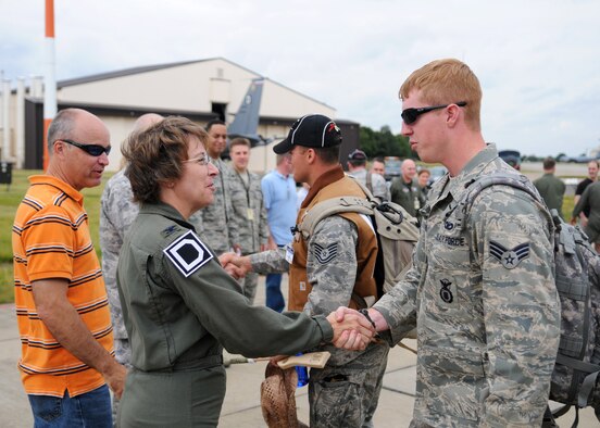RAF MILDENHALL, England, Col. Eden J. Murrie, Commander of the 100th Air Refueling Wing, greets Senior Airman Joseph Donahue, of the 100th Security Forces Squadron, upon his return from the 2009 Air Mobility Rodeo held at McChord Air Force Base, Washington July 26, 2009. The purpose of the competition is to focus on improving worldwide air mobility forces core abilities. (U.S. Air Force photo by Staff Sgt. Jerry Fleshman)