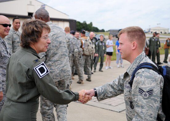 RAF MILDENHALL, England, Col. Eden J. Murrie, Commander of the 100th Air Refueling Wing, greets Senior Airman Johnny Keeton, of the 100th Security Forces Squadron, upon his return from the 2009 Air Mobility Rodeo, held at McChord Air Force Base, Washington July 26, 2009. The purpose of the competition is to focus on improving worldwide air mobility forces core abilities. (U.S. Air Force photo by Staff Sgt. Jerry Fleshman)