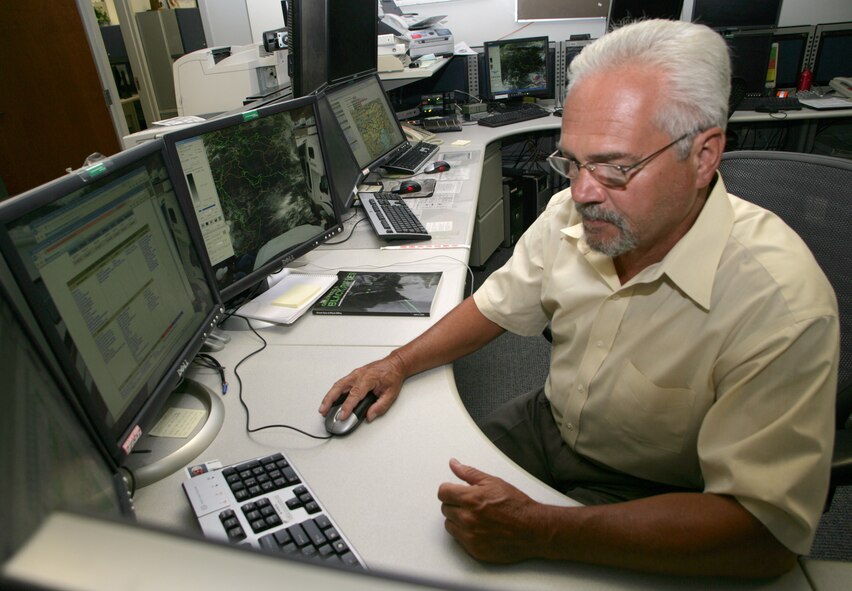 SHAW AIR FORCE BASE, S.C. -- John Thornsberry, lead meteorologist for the 28th Operational Weather Squadron here, reviews weather information that will be used in the U.S. Central Command's AOR. The 28th OWS provides weather products for all branches of the U.S. military and our coalition partners, covering 20 countries spanning thousands of miles on two continents. (Photo by Ryan Hansen)