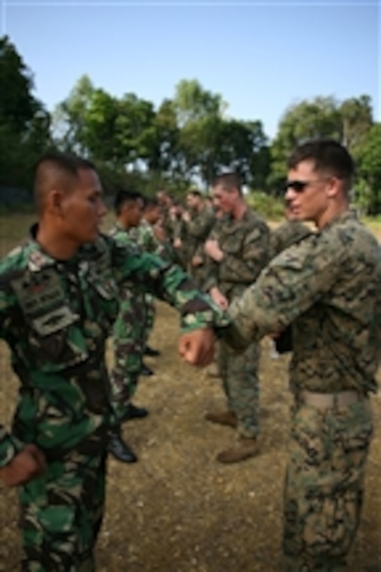 U.S. Marines from 1st Battalion, 24th Marine Regiment practice body blows with Indonesian marines from the 2nd Indonesian Marine Infantry Battalion during a Marine Corps martial arts program class in Jampang, Indonesia, on July 22, 2009.  The class is part of Cooperation Afloat Readiness and Training Indonesia 2009.  Cooperation Afloat Readiness and Training is a series of bilateral exercises held annually in Southeast Asia to strengthen relationships and enhance the operational readiness of the participating forces.  
