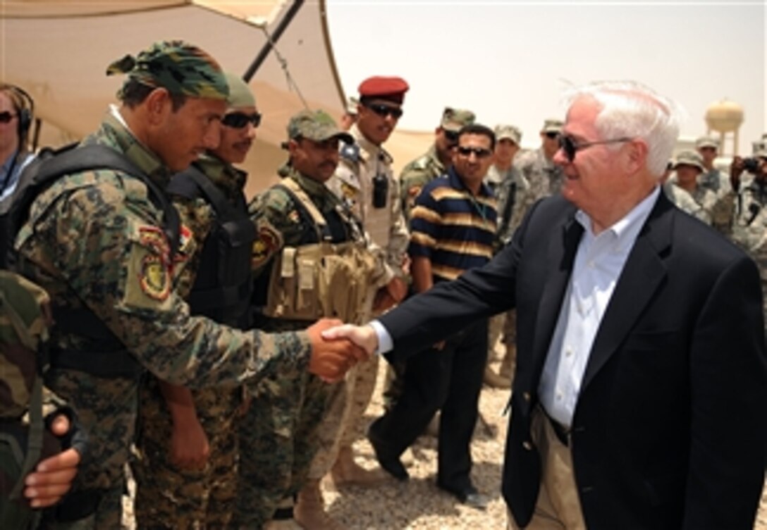 Secretary of Defense Robert M. Gates talks with Iraqi Security personnel during a site visit at Combined Operating Base Adder in Talil, Iraq, on July 28, 2009.  Gates visited Iraq receiving operational updates as well as meeting with key Iraqi officials.  