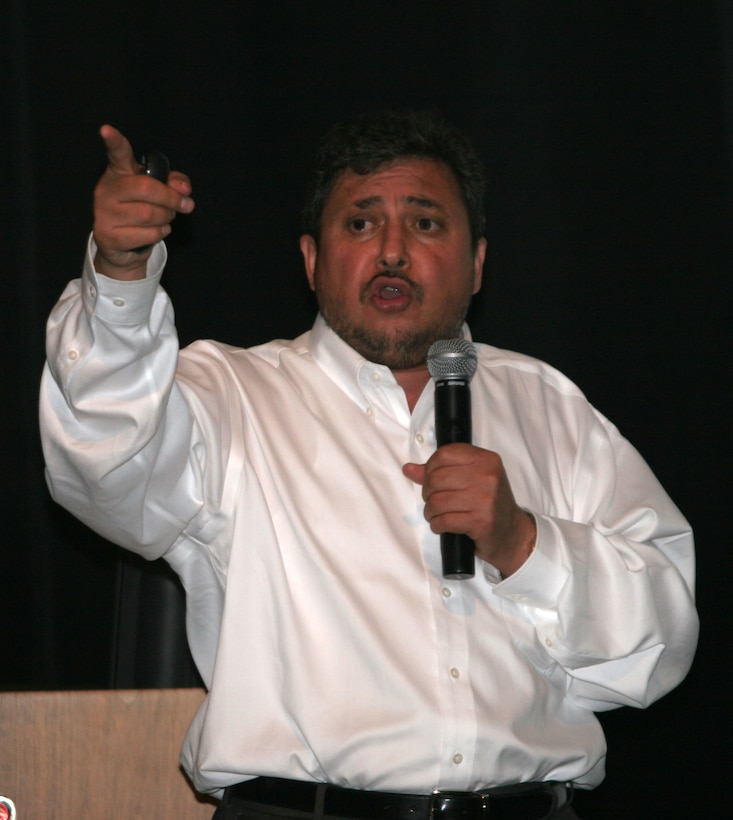 Dr. Ub Shenwari, a native of the Nangarhar province in eastern Afghanistan, emphasizes to Marines the importance of respecting the culture of the people of Afghanistan because it will prove 'we are there for their tranquility, stability and security,' he said, during cultural awareness training at the Base Theater, July 28 and 29. Shenwari came to America in 2007 to 'escape the Taliban' because he was the target of an attack due to his anti-extremist political views. During the course, Marines with 1st Marine Logistics Group learned about the economy, agriculture, healthcare, education, language and how to interact with Afghan people.