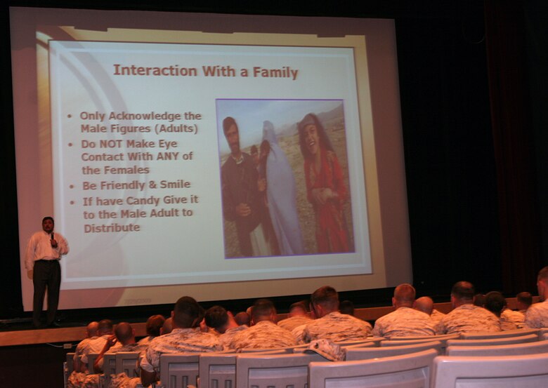 Dr. Ub Shenwari, a native of the Nangarhar province in eastern Afghanistan, instructs Marines with the 1st Marine Logistics Group how to interact with an Afghan family during cultural awareness training at the Base Theater, July 28 and 29. During the course, Marines with 1st Marine Logistics Group learned that respecting the Afghan culture plays a vital role in mission accomplishment. Marines also learned that greeting Afghans with a smile and saying 'Salaam Alaikum!' will help earn the trust and respect of Afghans.::r::::n::::r::::n::