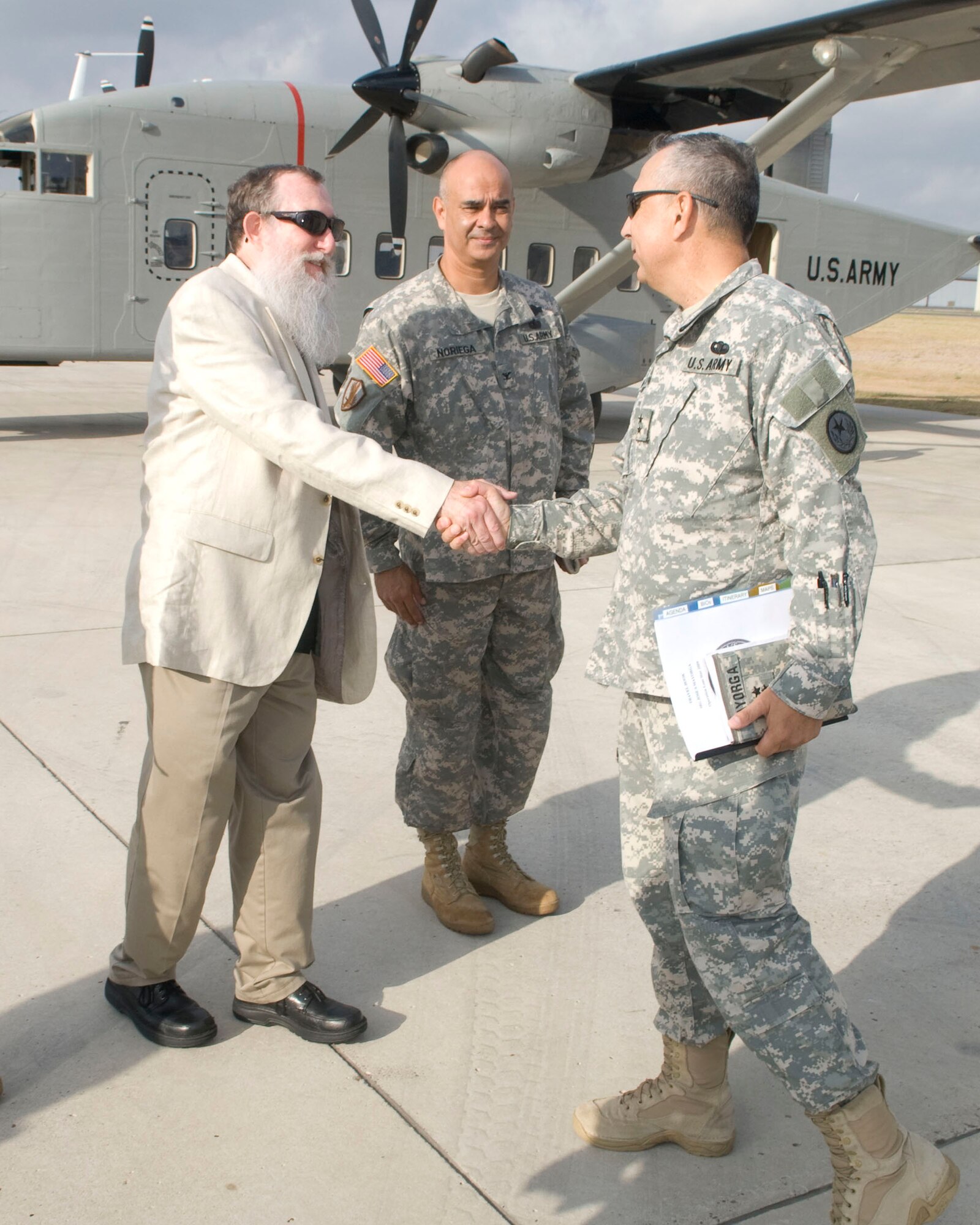 U.S. Army Major General Jose S. Mayorga, Texas Adjutant General is greeted by Dr. Brian Smith and U.S. Army Colonel Rick Noriega after arriving at McAllen Regional Airport enroute to Operation Lone Star VIP/Media Day at Pharr-San Juan-Alamo High School in Pharr, Texas. PSJA High School was also a designated site for Operation Lone Star.  Operation Lone Star is a Joint Civilian/Military Medical mission offering free Medical care to the region. Pharr,Texas, 30 July 2009.(USAF Photo by Master Sgt. Michael Lachman) 