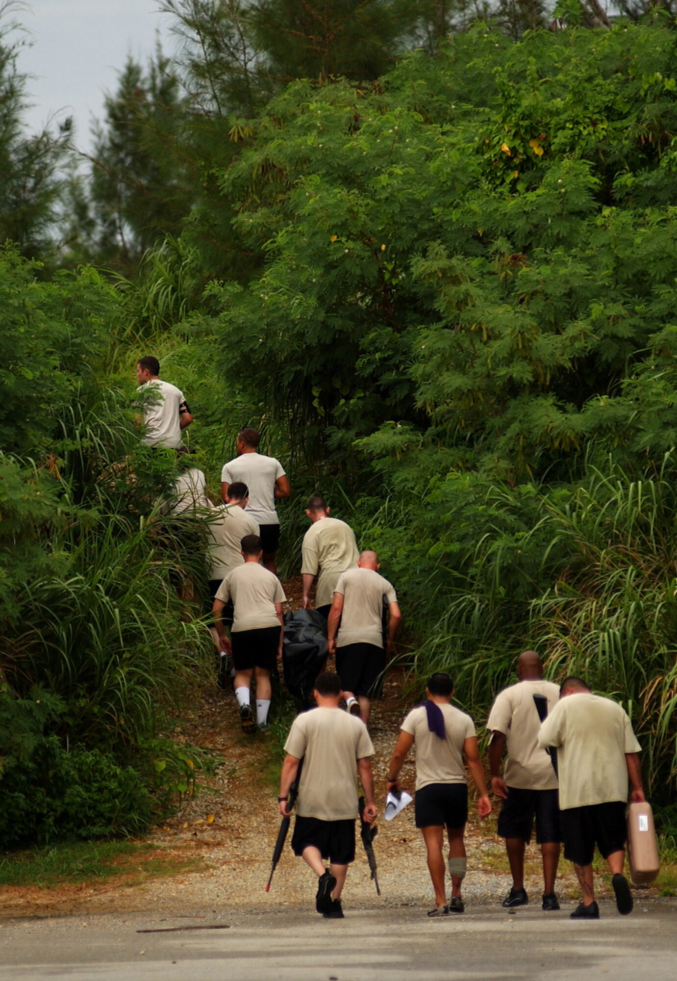 Students from the Airman Leadership School find their way to the next location, along with a different scenario they must solve during the Combat Leader Fitness/Mental Challenge July 27, Kadena Air Base, Japan. The Airmen learn leadership and followership skills as they undergo the course coordinated by the 554th Red Horse Squadron and the Erwin Professional Military Education.   (U.S. Air Force photo/Tech. Sgt. Rey Ramon)     