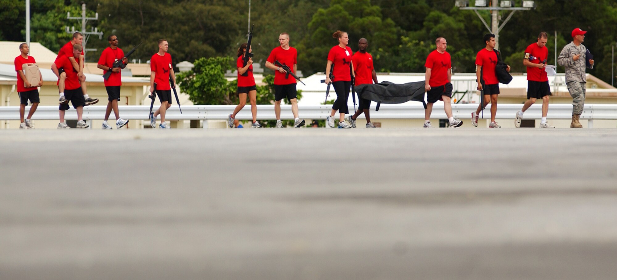 Students from the Airman Leadership School find their way to the next location, along with a different scenario they must solve during the Combat Leader Fitness/Mental Challenge July 27, Kadena Air Base, Japan. The Airmen learn leadership and followership skills as they undergo the course coordinated by the 554th Red Horse Squadron and the Erwin Professional Military Education.   (U.S. Air Force photo/Tech. Sgt. Rey Ramon)     