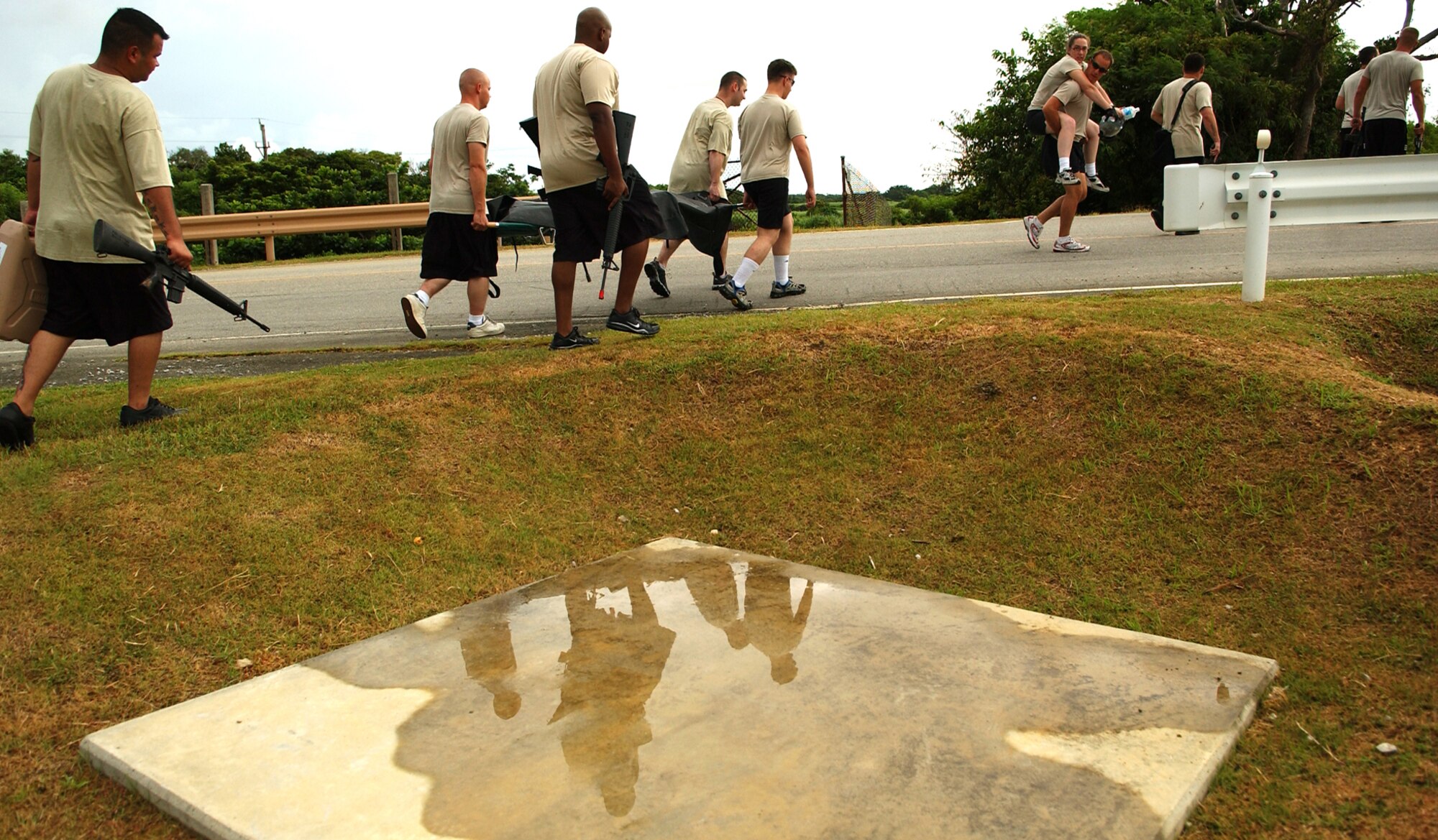 Students from the Airman Leadership School search for their next location during the Combat Leader Fitness/Mental Challenge July 27, Kadena Air Base, Japan. The Airmen learn leadership and followership skills as they undergo the course coordinated by the 554th Red Horse Squadron and the Erwin Professional Military Education.  (U.S. Air Force photo/Tech. Sgt. Rey Ramon)  