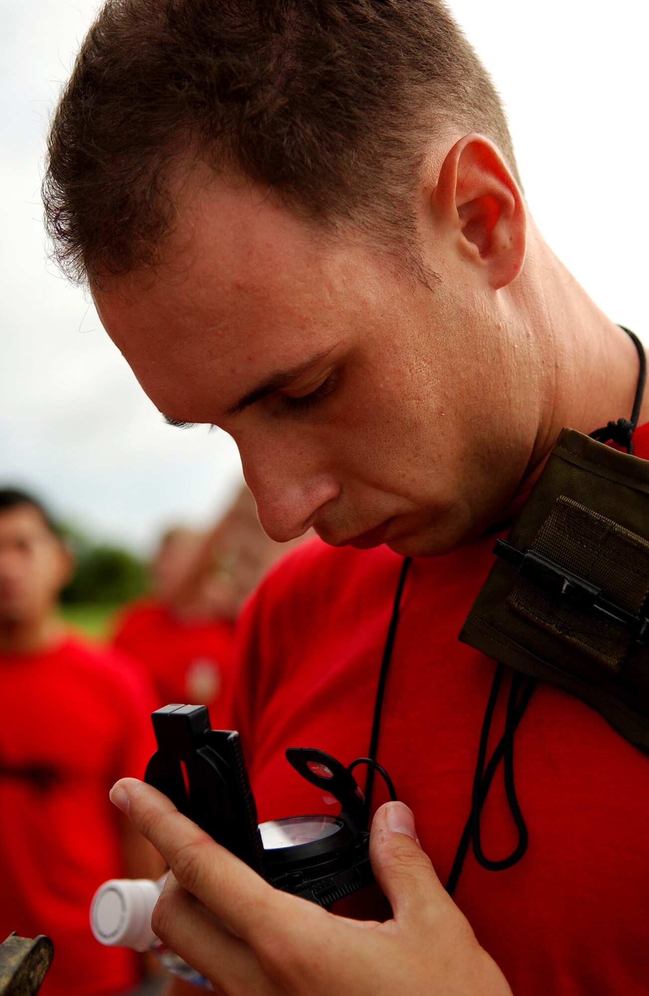 A student from the Airman Leadership School directs the group to the next location during the Combat Leader Fitness/Mental Challenge July 27, Kadena Air Base, Japan. The Airmen learn leadership and followership skills as they undergo the course coordinated by the 554th Red Horse Squadron and the Erwin Professional Military Education.(U.S. Air Force photo/Tech. Sgt. Rey Ramon)     