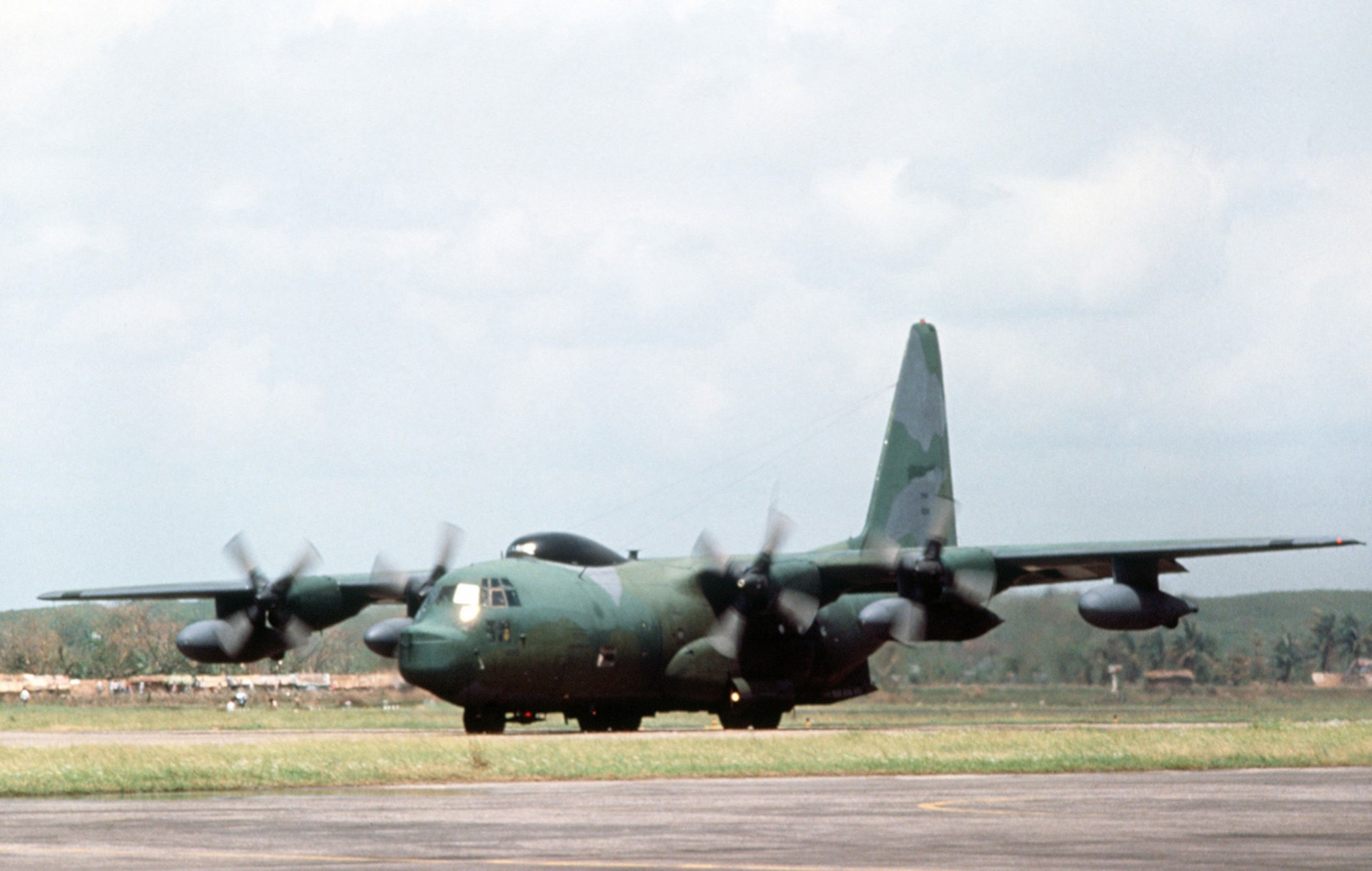 A 17th Special Operations Squadron HC-130 taxis on the runway at Chittagong Air Base April 30, 1991, after arriving to support disaster relief efforts as part of Operation SEA ANGEL after a cyclone devastated areas in Bangladesh. (U.S. Air Force photo by Staff Sgt. Val Gempis)