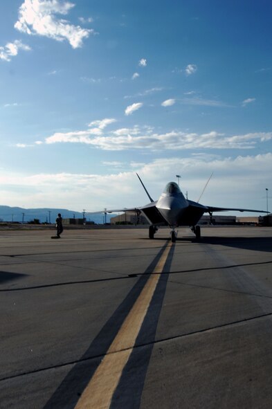 HOLLOMAN AIR FORCE BASE, N.M. -- An F-22A Raptor from the 49th Fighter Wing here taxis on the ramp before flying out to Elmendorf Air Force Base, Alaska, July 19, to participate in Red Flag - Alaska. Red Flag is an advanced aerial combat training exercise. Since 1975, air crews from the United States Air Force, other U.S. military branches and allies take part in the exercise. (U.S. Air Force photo by Staff Sgt. Anthony Nelson Jr)