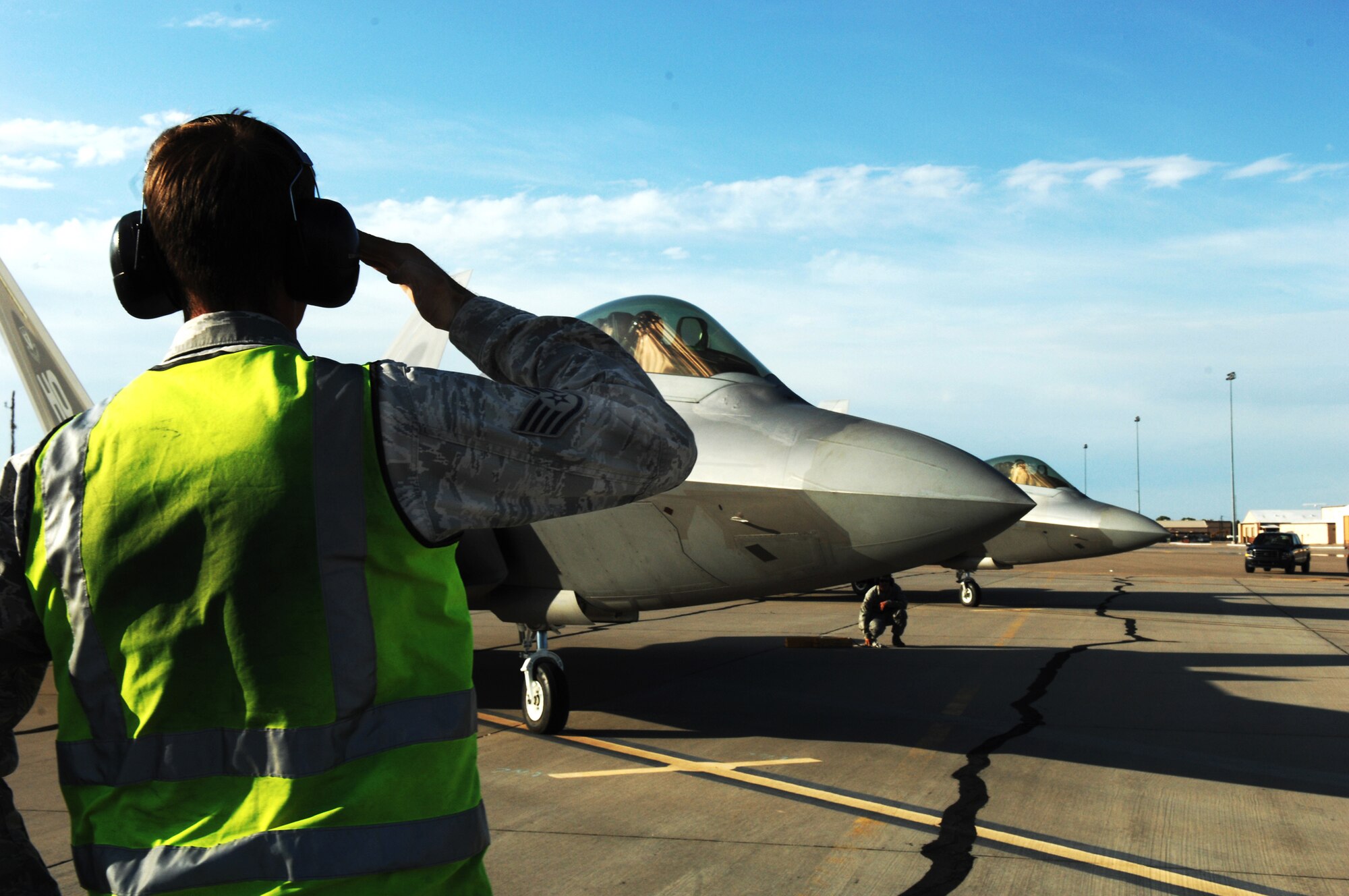 HOLLOMAN AIR FORCE BASE, N.M. -- Staff Sgt. John Bryan, 49th Aircraft Maintenance Squadron, renders a final salute to the pilot before flying out from Holloman to Elmendorf Air Force Base, Alaska, July 19, for a Red Flag exercise. The purpose of Red Flag is to train pilots from the U.S., NATO and other allied countries for real combat situations. (U.S. Air Force photo by Staff Sgt. Anthony Nelson Jr)
