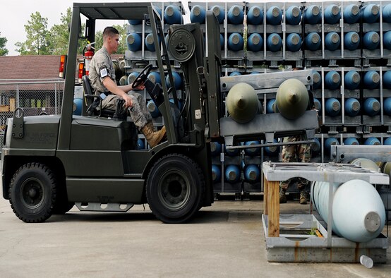 MOODY AIR FORCE BASE, Ga. -- Airman 1st Class Brian Mathis, 23rd Equipment Maintenance Squadron munitions flight stockpile surveillance crewmember, moves a missile crate here July 15. The 23rd EMS munitions flight separates their munitions stockpiles into three different buildings to minimize dangerous work areas. (U.S. Air Force photo by Airman 1st Class Joshua Green)