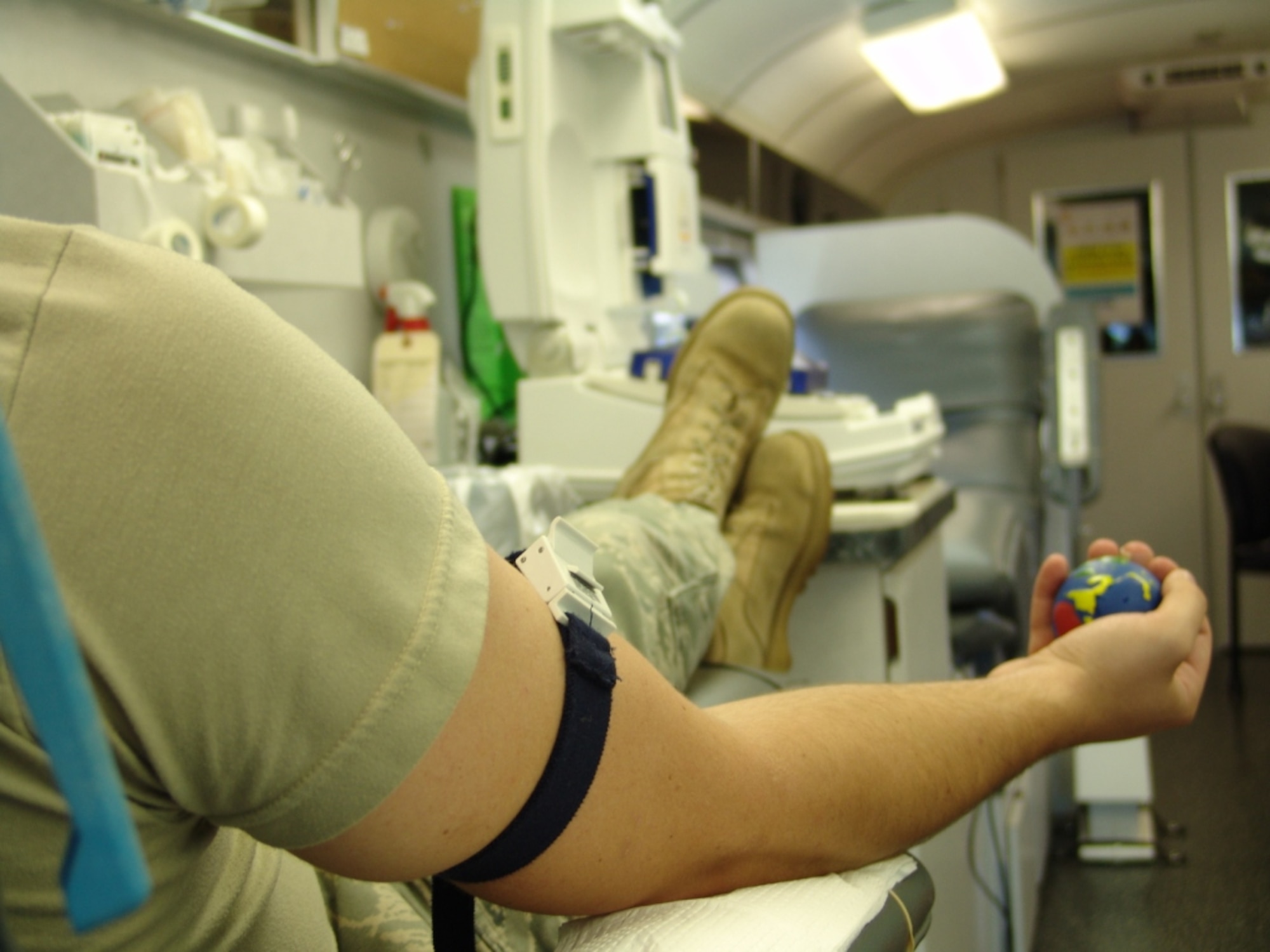An Eglin Airman prepares to give blood during Northwest Florida Blood Services' blood drive at Building 11, July 30.  NFBS visits Eglin almost weekly for blood drives.
