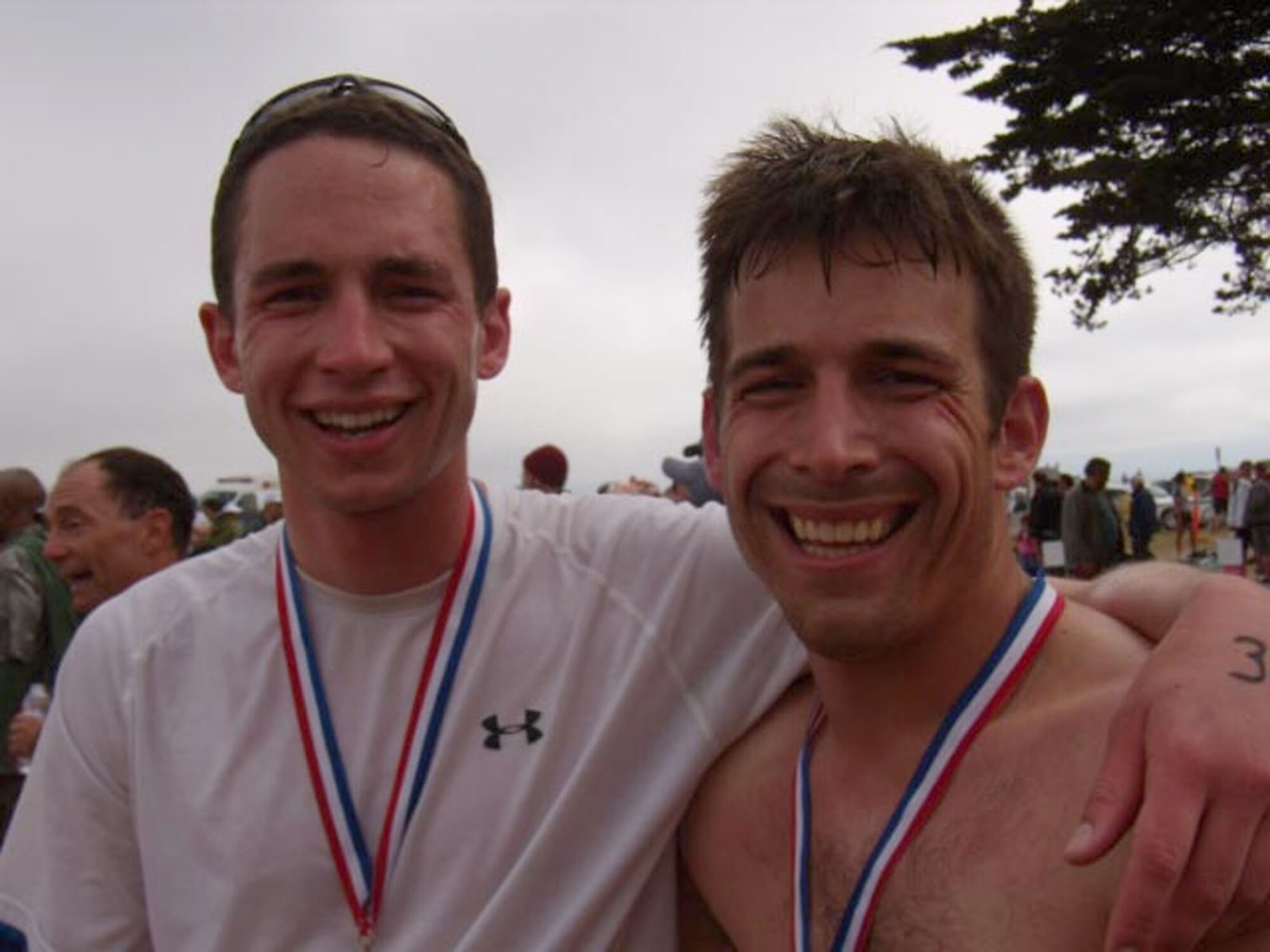 1st Lts. Richard Young and Damon Bosetti, enjoy a rest and a smile after completing the Alcatraz Challenge in San Francisco July 12. The four missile combat crew members from the 10th and 490th Missile Squadrons at Malmstrom trained for six months to compete in the 1.5-mile swim and seven-mile run within the San Francisco Bay. (Courtesy photo)