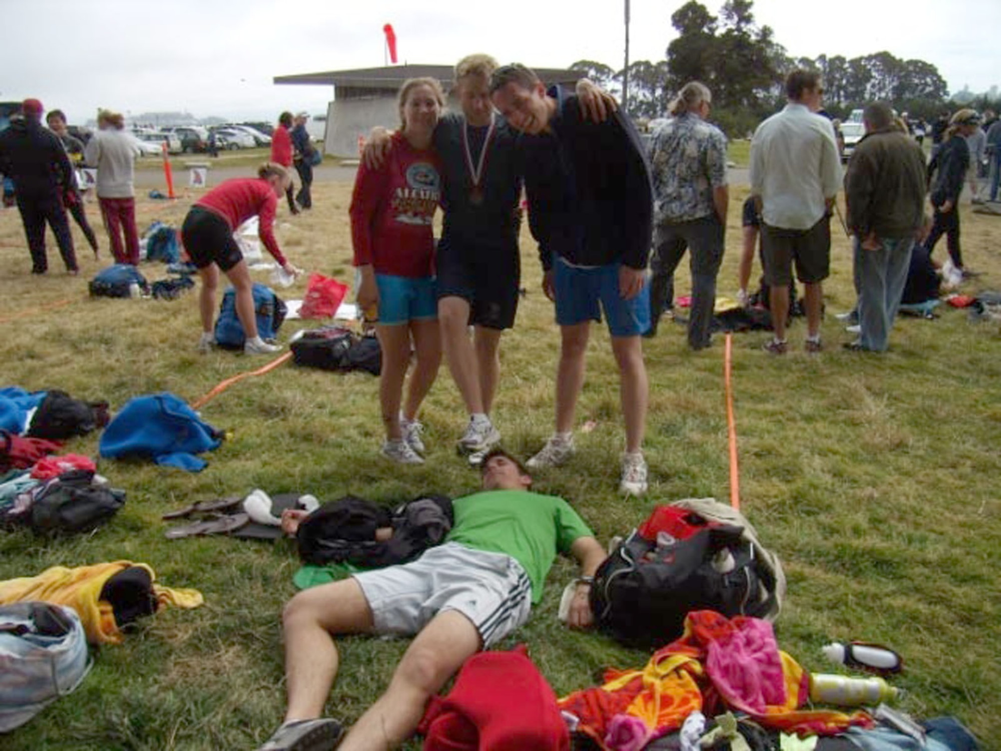 (Left to right) 1st Lt. Michaela Garcia, 2nd Lt. James Schannep, 1st Lts. Richard Young and Damon Bosetti (ground), enjoy a rest and a smile after completing the Alcatraz Challenge in San Francisco July 12. The four missile combat crew members from the 10th and 490th Missile Squadrons at Malmstrom trained for six months to compete in the 1.5-mile swim and seven-mile run within the San Francisco Bay. (Courtesy photo)