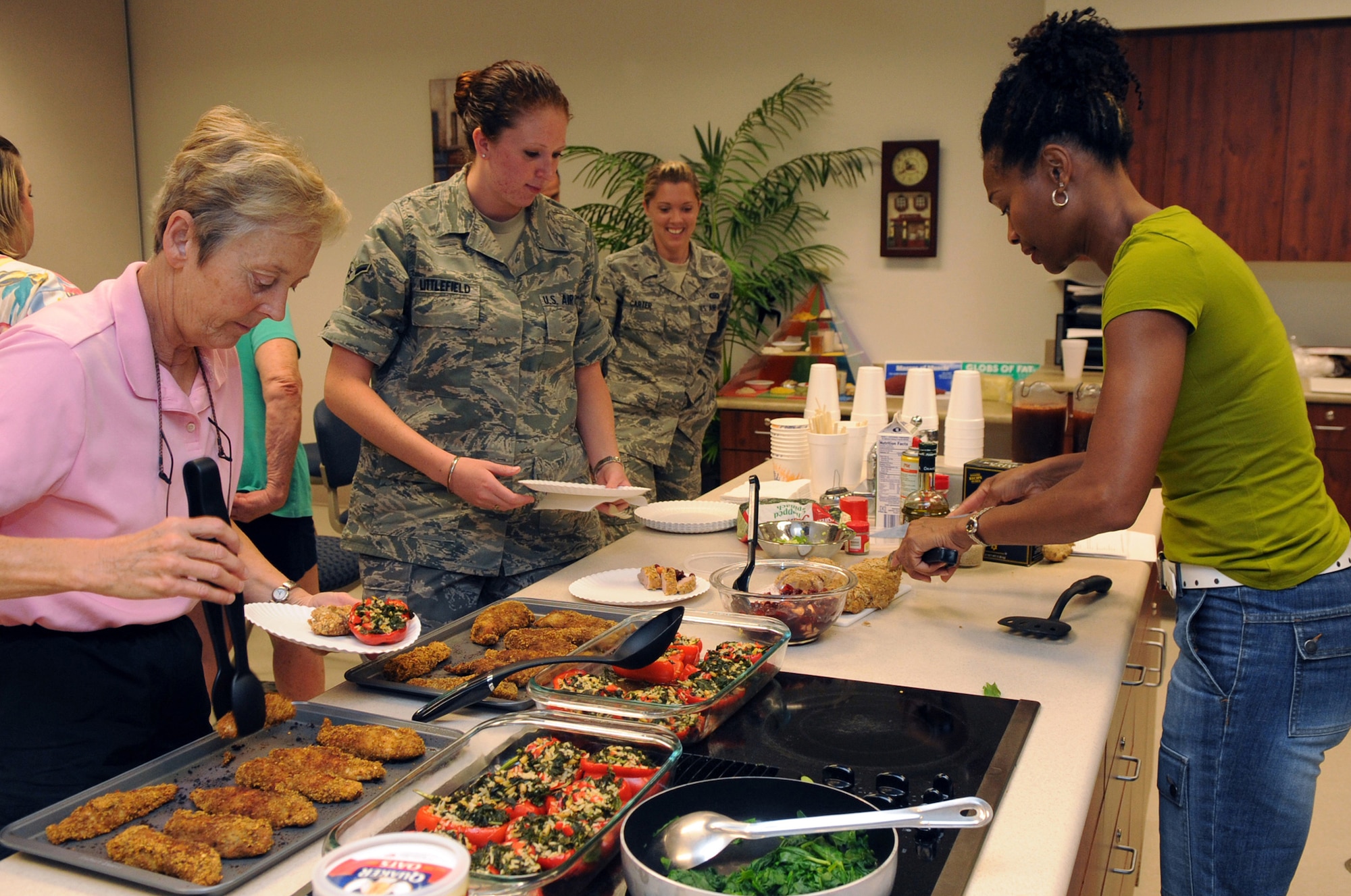 BUCKLEY AIR FORCE BASE, Colo. – Sandy Jefferson serves a low-fat, low-sodium meal following a Healthy Heart Cooking Demonstration class. Participants learned alternative methods of cooking your favorite dishes: ways to lower fat, sodium and cholesterol, making the dishes you love heart healthier. (U.S. Air Force photo by Senior Airman John Easterling)