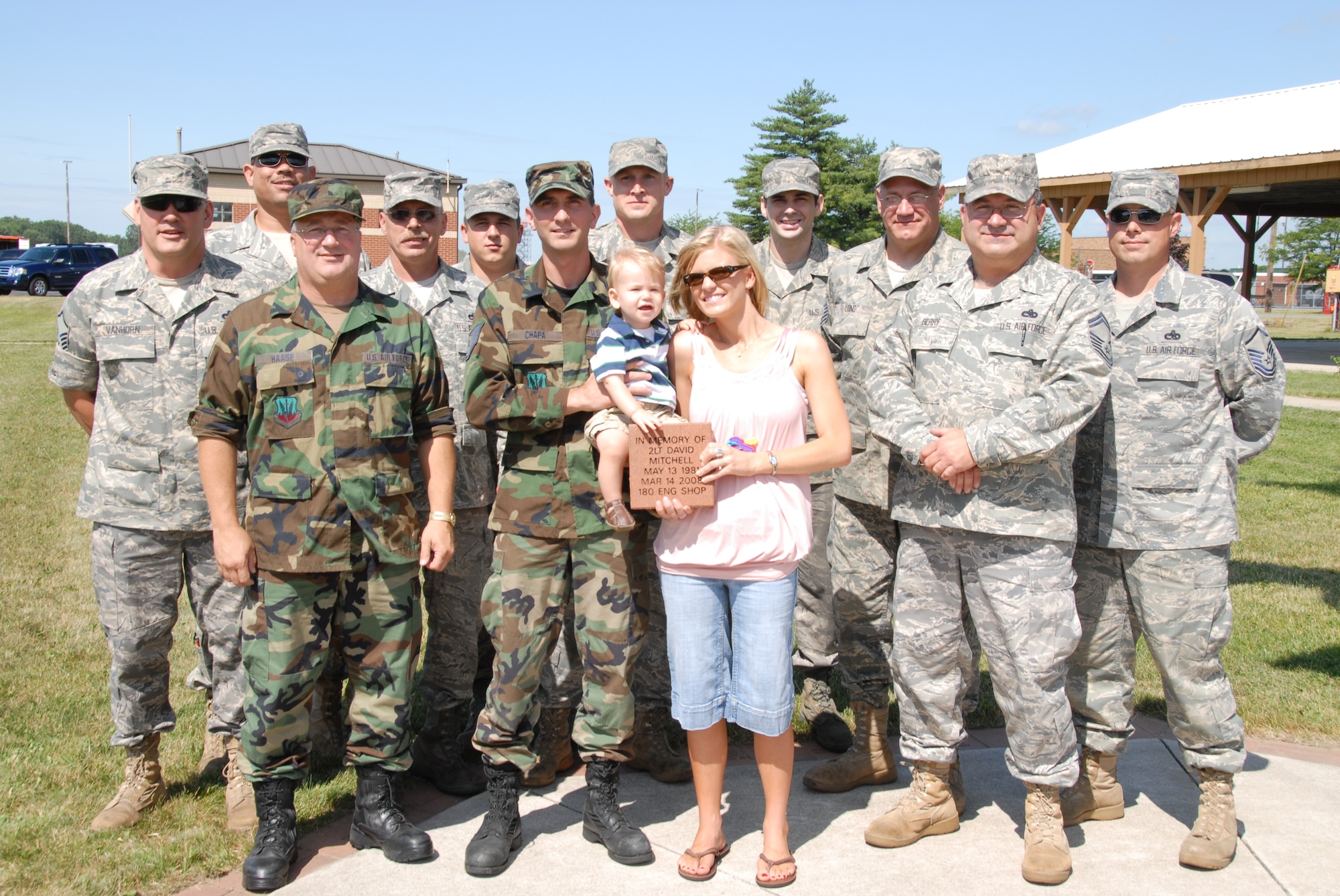 Members of the 180th engine shop remembered 2nd Lt. David Mitchell by purchasing a brick that was placed by his wife, Kristi and their son, Brayden at the 180th flag pole in front of the wing headquarters building.