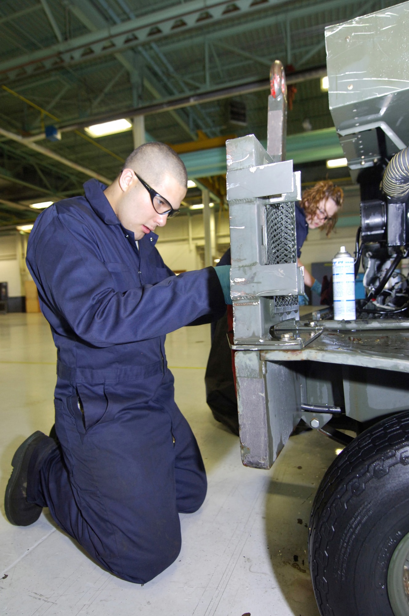 Airman 1st Class Michael Monge-Sansone oils a dash 95 large air start system July 27 at Minot Air Force Base, N.D. The 5th Maintenance Squadron Aerospace Ground Equipment Flight recently initiated an investment expected to yield a return of 60 saved man-hours weekly and more than $1 million annually. Airman Monge-Sansone is an AGE technician. (U.S. Air Force photo/Tech. Sgt. Lee A. Osberry Jr.) 