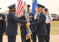 7/24/2009 - Maj. Gen. Alfred Flowers, 2nd Air Force commander, hands over command of the 37th Training Wing to Col. William H. Mott V at a change of command ceremony July 24 at the parade grounds. (U.S. Air Force photo/Robbin Cresswell)