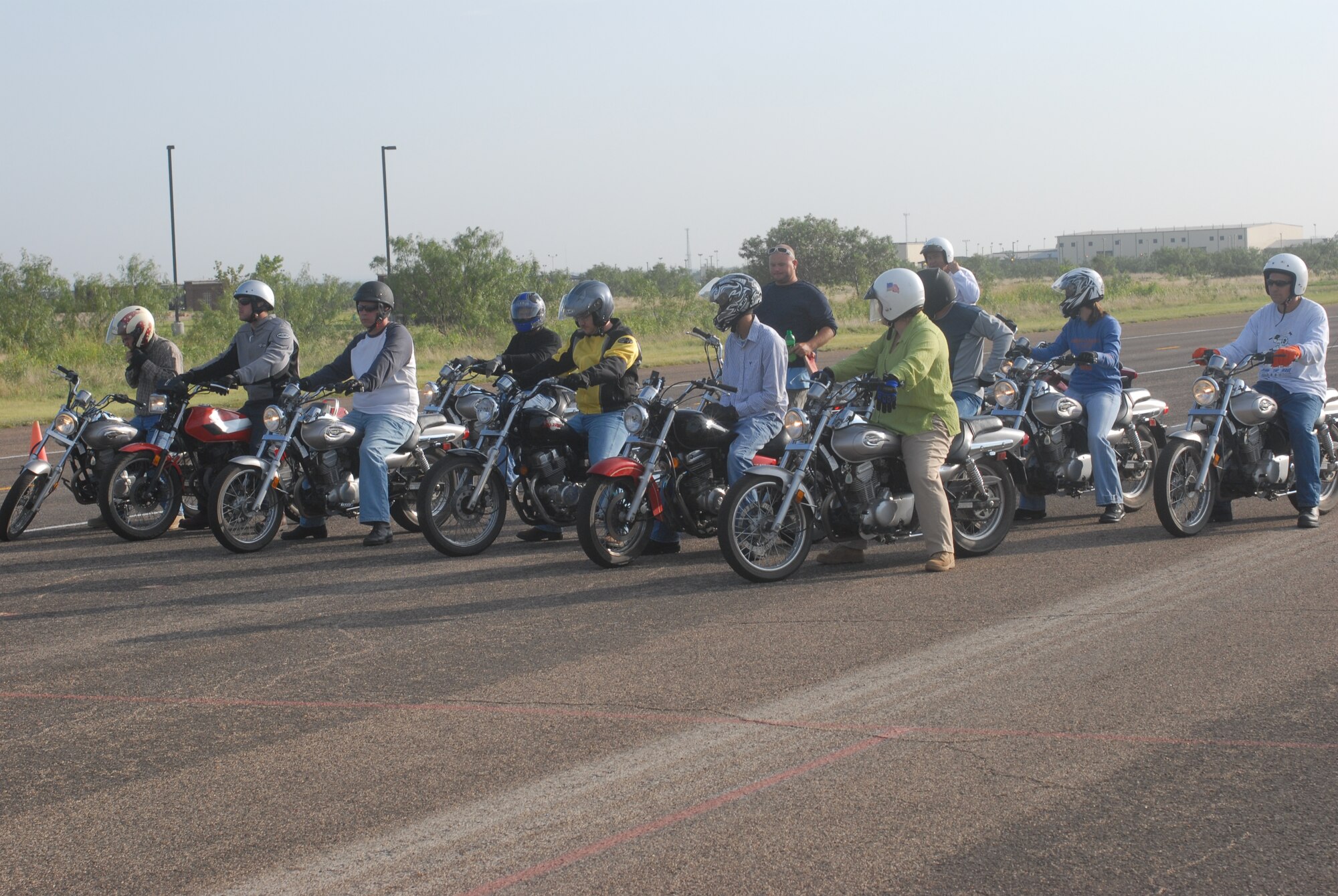 Members of Team Goodfellow prepare to start their motorcycle training July 28. The training is done by Marshall Munce and his son Ian Munce. (U.S. Air Force photo by Airman Clayton Lenhardt)