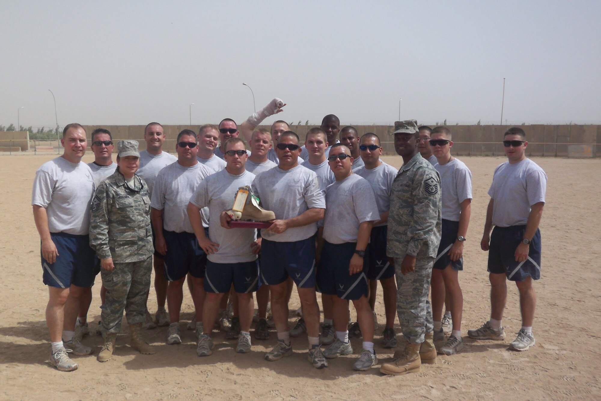 WRIGHT-PATTERSON AIR FORCE BASE, Ohio – Maj. John Marang, 1st Lt. Sean Donelan, and Tech. Sgt. Daniel Fitzgerald, all from the 87th Aerial Port Squadron, currently deployed with the 332nd Expeditionary Logistics Readiness Squadron, Joint Base Balad, played for the 332nd ELRS team during the 332nd Expeditionary Mission Support Group inaugural four squadron softball tournament in July.  The 332nd ELRS team beat the 332nd Expeditionary Force Support Squadron in the first game 18-3 and went on to beat the 332nd Expeditionary Civil Engineer Squadron in the championship game 16-12. More than 60 reservists from the 87th APS are currently serving at Joint Base Balad.  (courtesy photo)