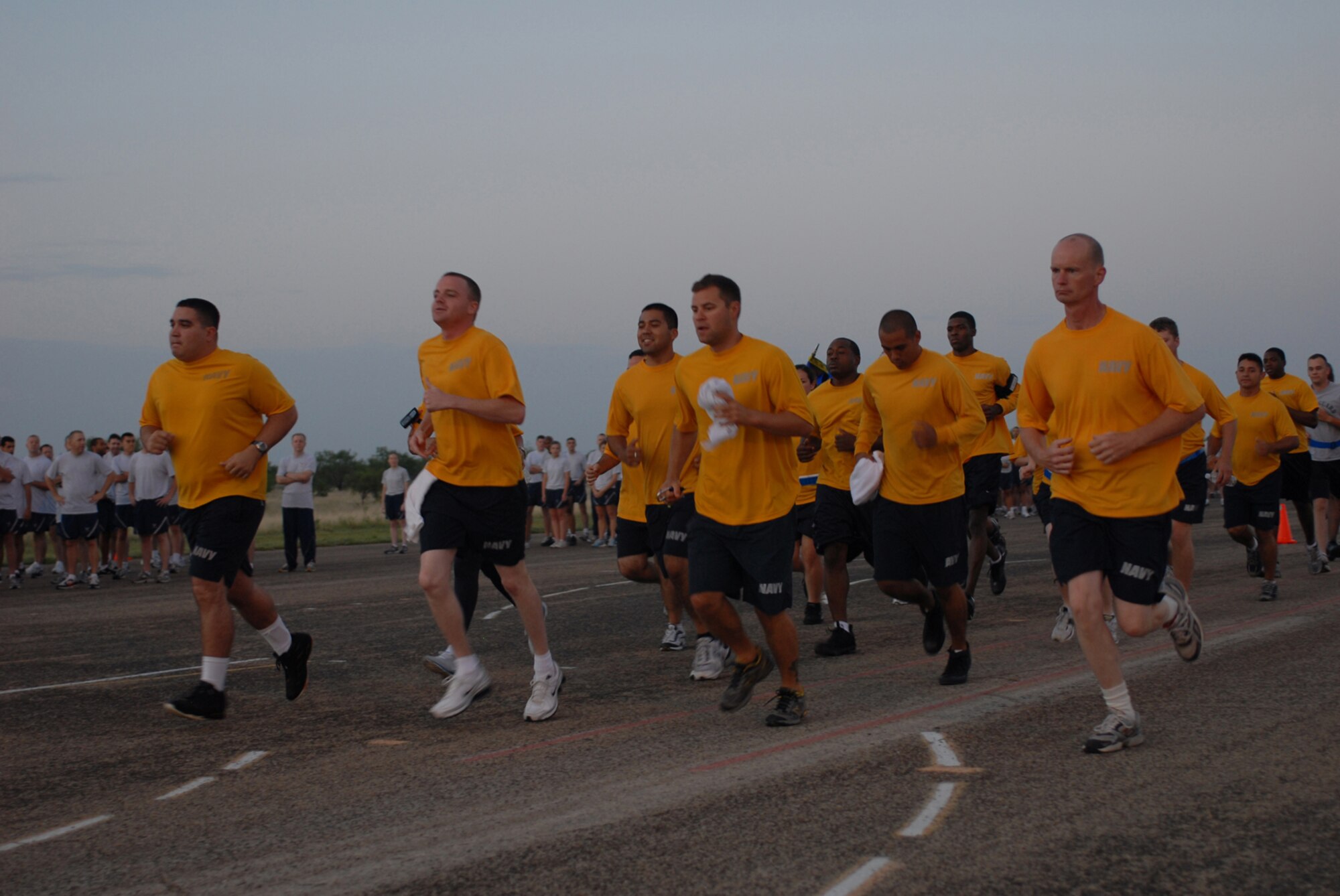 Sailors from the Center for Information Dominance Detachment, run in formation during the quarterly wing run, July 24. ( U.S. Air Force photos by Staff Sgt. Laura McFarlane)