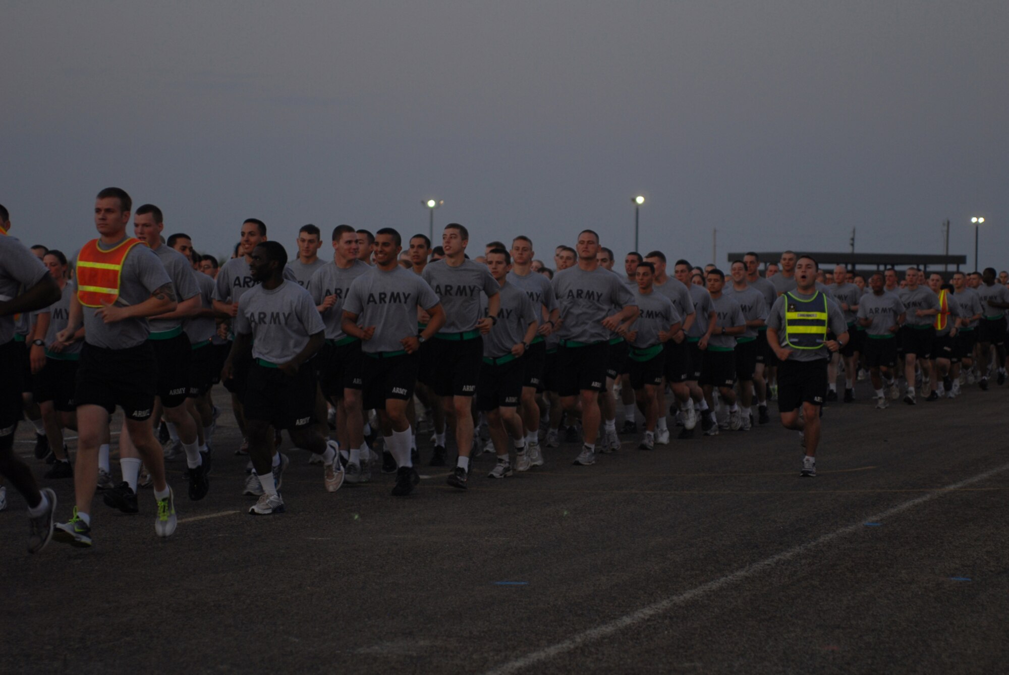 Soldiers from the 344th Military Intelligence Battalion, run in formation during the quarterly wing run, July 24. (U.S. Air Force photos by Staff Sgt. Laura McFarlane)