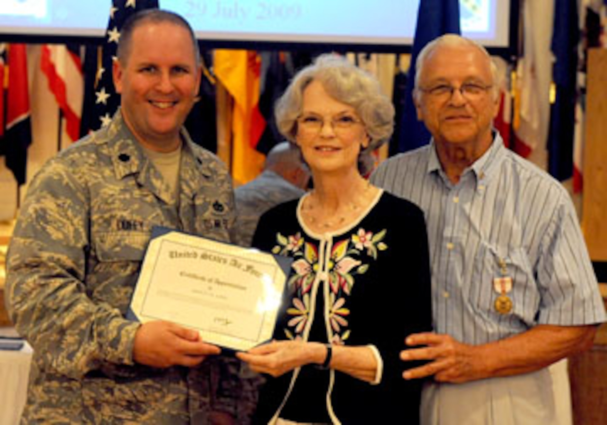 DYESS AIR FORCE BASE, Texas — Shirley Jupin receives a certificate of appreciation here July 29 at the base Heritage Club. Mrs. Jupin received the award for her support during her husband’s 57 years of service.  John Junior Jupin served 23 years active duty and 34 years as a civilian. A retirement ceremony was held July 29 at the Heritage Club here. Mr. Jupin retired from the Air Force in 1975 as a chief master sergeant.  (U.S. Air Force photo by Senior Airman Domonique Washington)