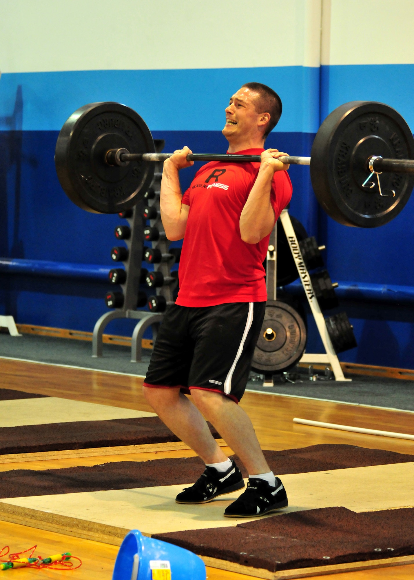 U.S. Air Force Capt. Jeremiah Buckenberger, 68th Civil Engineer Squadron chief of integration performs a weight lifting movement as part of his CrossFit workout of the day at the Ramstein Air Base North Side Gym, Aug. 28, 2009.(U.S. Air Force photo by Staff Sgt. Markus Maier)