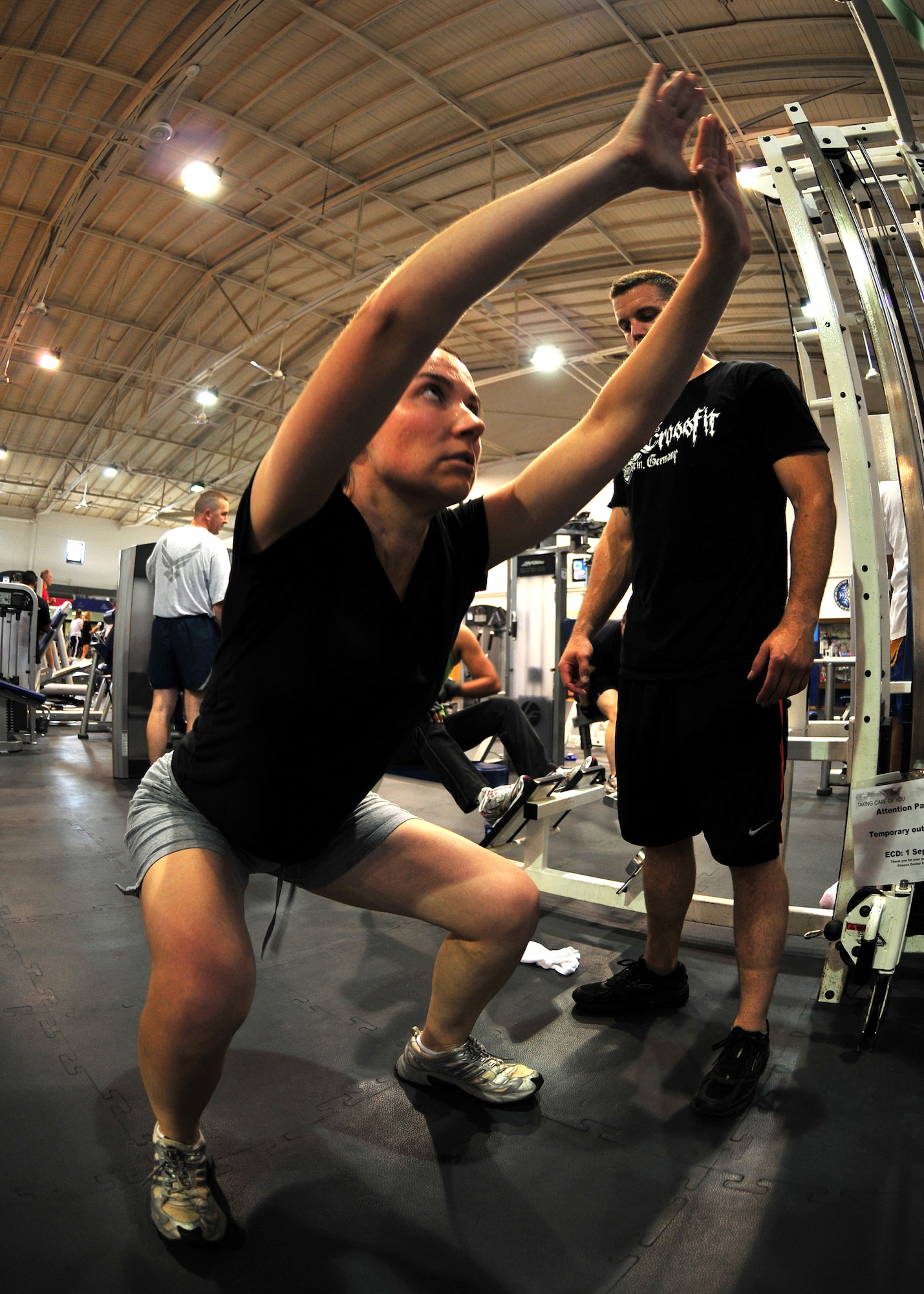 Kirsten Steward, a speech language pathologist at the Ramstein Elementary School, performs squats as part of her CrossFit workout of the day at the Ramstein Air Base North Side Gym, Aug. 28, 2009. (U.S. Air Force photo by Staff Sgt. Markus Maier)