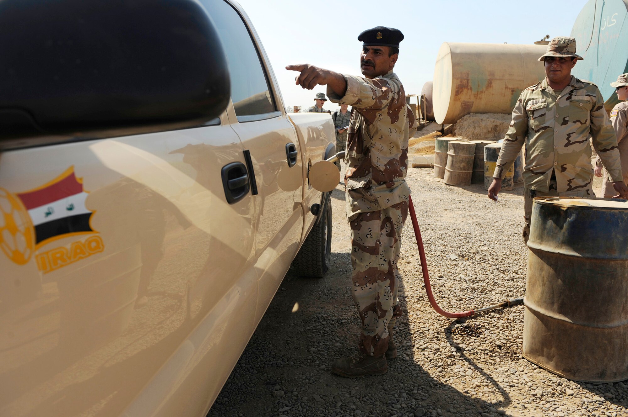 Iraqi soldiers refuel their vehicles July 11 at Camp Taji, Iraq. The Iraqi fuels depot is run exclusively by the Iraqi army with some assistance from an American Airman assigned to the Logistics Military Adviser Team. (U.S. Air Force photo/Staff Sgt. Michael B. Keller) 
