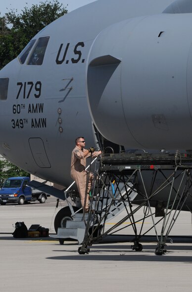 U.S. Air Force Staff Sgt. Tony Rivera from Travis Air Force Base, begins a post flight inspection on a C-17 Globemaster III after landing on Ramstein Air Base, Germany, July 29, 2009. (U.S. Air Force photo by Airman 1st Class Grovert Fuentes-Contreras)(Released)