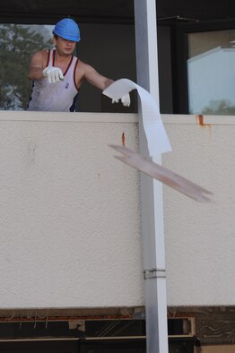 German contractors strip down the dorms in preparation for demolition, Ramstein Air Base, Germany, July 29, 2009. A team recently came in and assessed all of the facilities throughout the Kaiserslautern Military Community. The plan is basically to tear down the oldest and worst buildings that have outlived their life cycle. (U.S. Air Force photo by Airman 1st Class Caleb Pierce) 