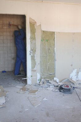 German contractors strip down the dorms in preparation for demolition, Ramstein Air Base, Germany, July 29, 2009. A team recently came in and assessed all of the facilities throughout the Kaiserslautern Military Community. The plan is basically to tear down the oldest and worst buildings that have outlived their life cycle. (U.S. Air Force photo by Airman 1st Class Caleb Pierce) 