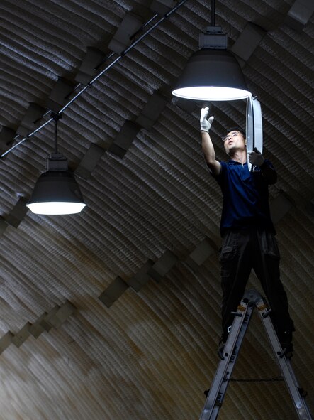 Contract Electrician Konho Yi replaces a metal halide bulb in one of the K-SPAN housing units at Rush Park (tent city) on  Osan Air Base, Republic of Korea July 28. The bulbs are being replaced in preparation for Ulchi Freedom Guardian, a joint bilateral exercise expected to start in August. More than 550 military members will participate in the exercise. UFG is a regularly scheduled summer exercise involving forces from both the Republic of Korea and the U.S. (U.S. Air Force photo/Senior Airman Stephenie Wade)