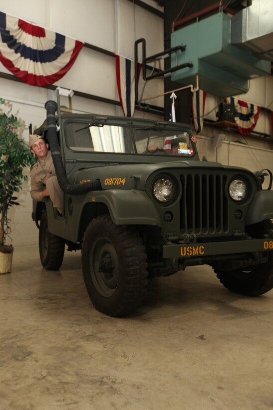 Service members, retirees and friends within the local community gathered together at the Jacksonville American Legion, July 31, to enjoy ‘A Summers Night with our Heroes,’ an event, to raise money for the Museum of the Marine. As patrons moseyed around the building, they were able to observe the old World War II and Vietnam War vehicles. Live mannequins dressed in period uniforms gave a taste of how the Marine Corps has evolved over the years, while it brought to life a bit of history. ::n::