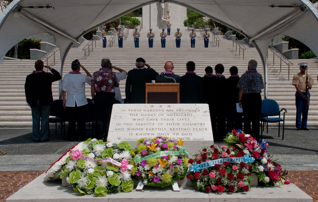 Service members, veterans, friends and family pay their respects during a 21 gun salute 31 during the 56th Korean War Armistice Day Ceremony at the National Memorial Cemetery of the Pacific. Dozens of veterans, their friends and family attended the wreath laying ceremony in memory of those who fought, died and did not return.  (Official Marine Corps Photo by Sgt. Juan D. Alfonso)(released)