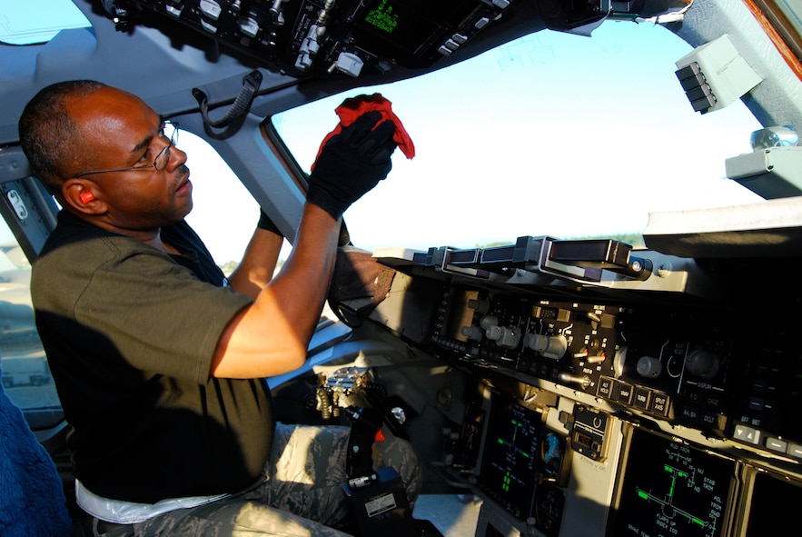 Master Sgt. Alvin Jackson Jr., 712th Aircraft Maintenance Squadron, ensures the cockpit windows of Team Dover's C-17 Globemaster III are spot free prior to takeoff for a nighttime graded evaluation July 21. Sergeant Jackson joins Airmen from the 512th and 436th Airlift Wings to compete in the 2009 Air Mobility RODEO at McChord Air Force Base, Wash., July 19-25, where they are graded on aspects of airlift operations including maintenance, aerial port, security forces and aircrew events. (U.S. Air Force photo/Staff Sgt. Steve Lewis)