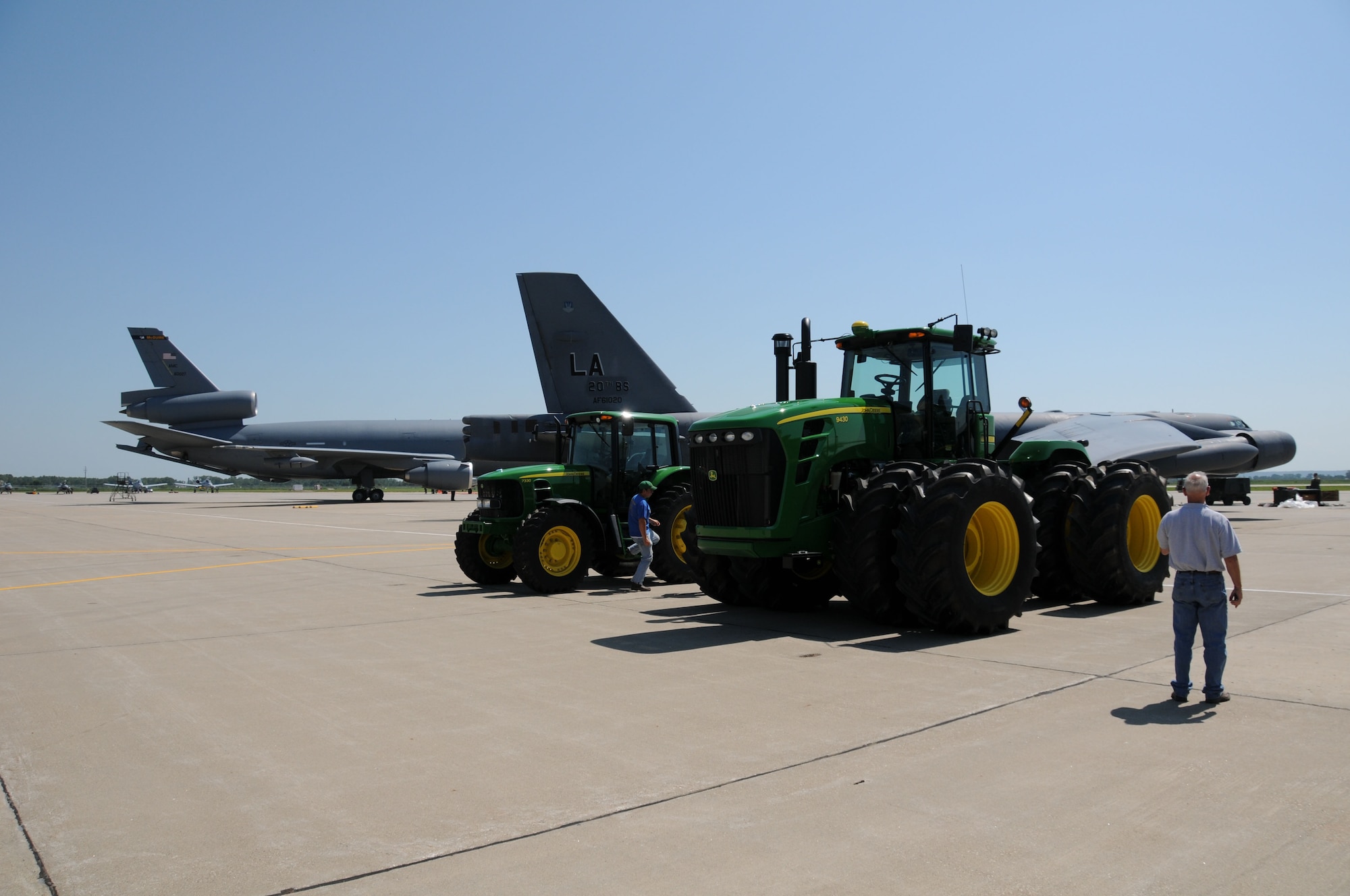 A local implement dealer lines up his tractors on the flight line at the Sioux Gateway Airport / Col. Bud Day Field, in Sioux City, Iowa.  The 185 Air Refueling Wing is hosting an Air & Ag Expo.  Official Air Force Photo by: MSgt. Bill Wiseman (released)