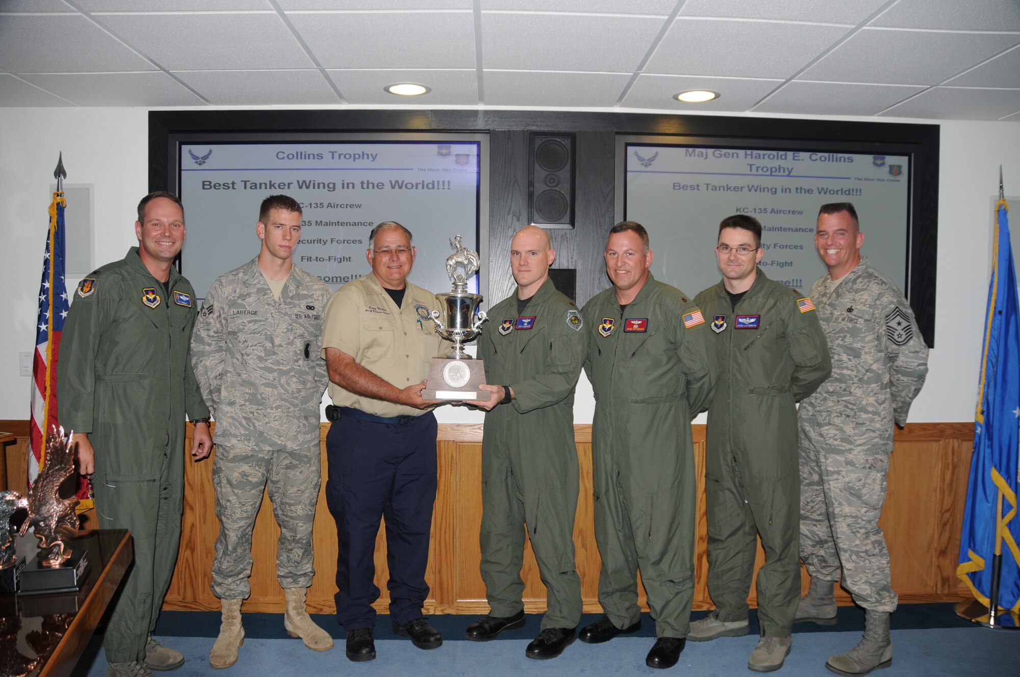 ALTUS AIR FORCE BASE, Okla. -- Members the Altus RODEO Team along with Col. Jon "Ty" Thomas (far left), 97th Air Mobility Wing commander, and Chief Master Sgt. Eric Molloy (far right), 97 AMW command chief, honor the team's accomplishments during a Wing Stand Up meeting July 28. The Altus RODEO Team garnered Best Tanker Wing  -- one of the top three trophies awarded at the competition -- during the 2009 Air Mobility RODEO at McChord AFB, Wash., during the week prior. (U.S. Air Force photo/Senior Airman Cherice Bryant)
