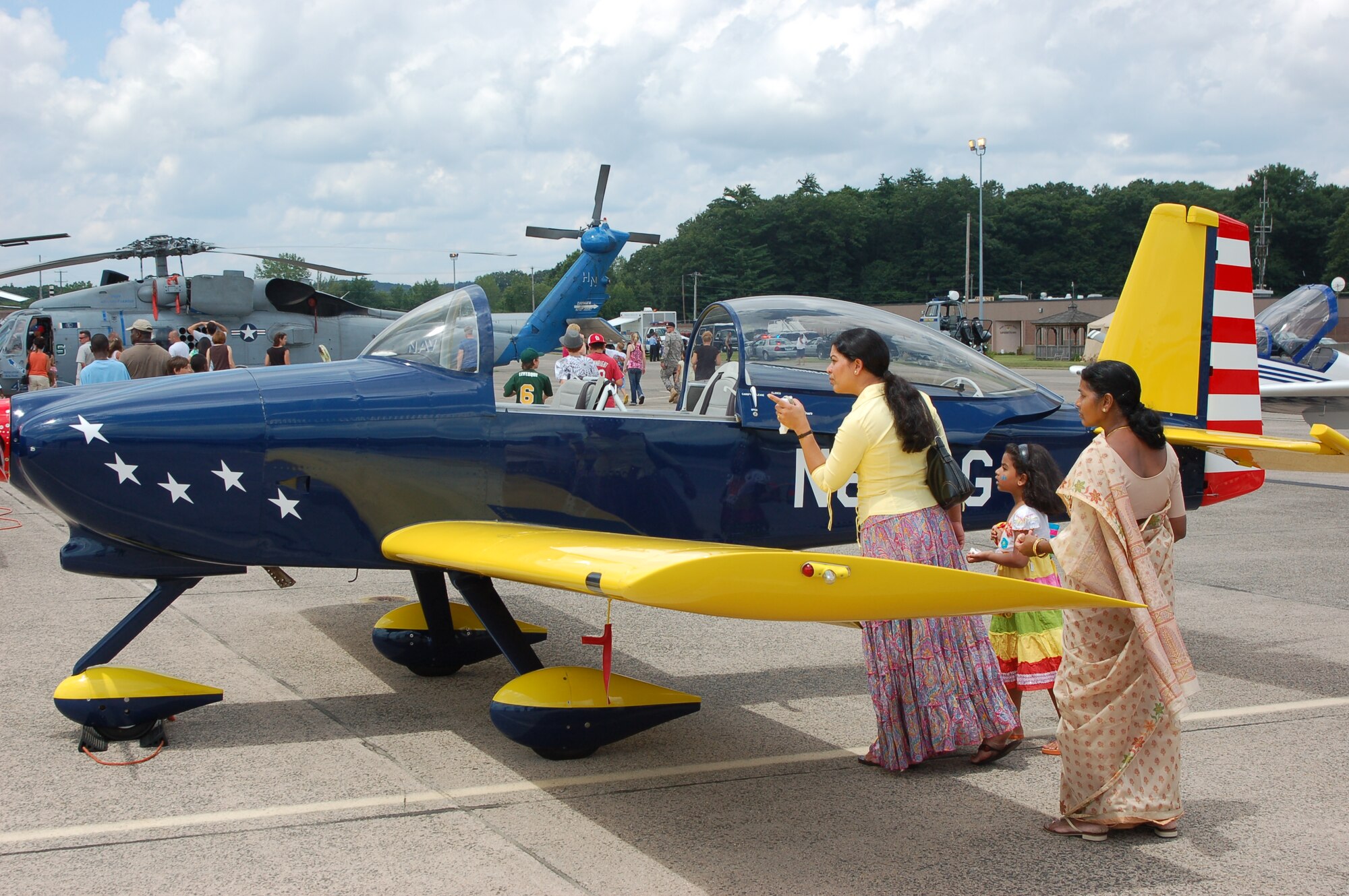 Curious visitors check out one of the experimental aircraft from EAA Chapter 166 during the Space and Aviation Day open house at Bradley ANG Base, East Granby, Conn. July 18, 2009.  The New England Air Museum and the Connecticut Fire Academy also opened their doors to the public as part of the event.  (U.S. Air Force photo by Tech. Sgt. Joshua Mead)
