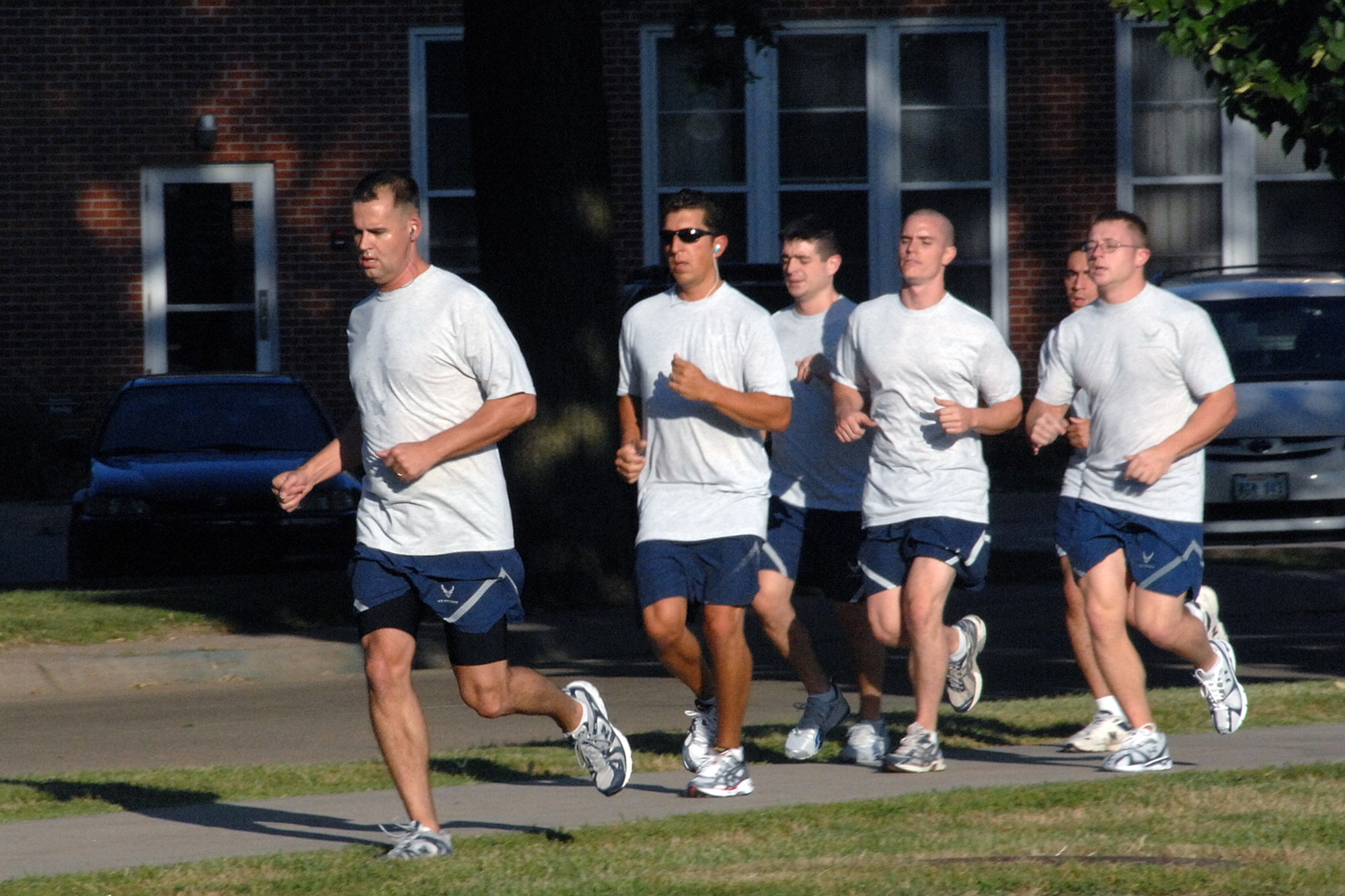 OFFUTT AIR FORCE BASE, Neb.-- A group of Airmen with the 97th Intelligence Squadron take advantage of the nice weather July 31 at the parade grounds and embarks on a forty-five minute run for morning physical training. The squadron did some light stretching before the run to ensure the runners were properly warmed up.