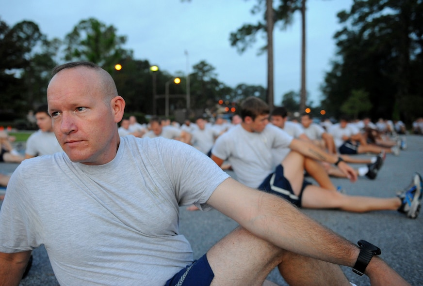 MOODY AIR FORCE BASE, Ga. -- Airmen from the 93rd Air Ground Operations Wing stretch before participating in a two-mile formation run with Brig. Gen. Michael Longoria, 93rd AGOW commander, here July 30. General Longoria relinquished command of the 93rd AGOW during a change of command ceremony held on July 31. (U.S. Air Force photo by Senior Airman Gina Chiaverotti-Paige)