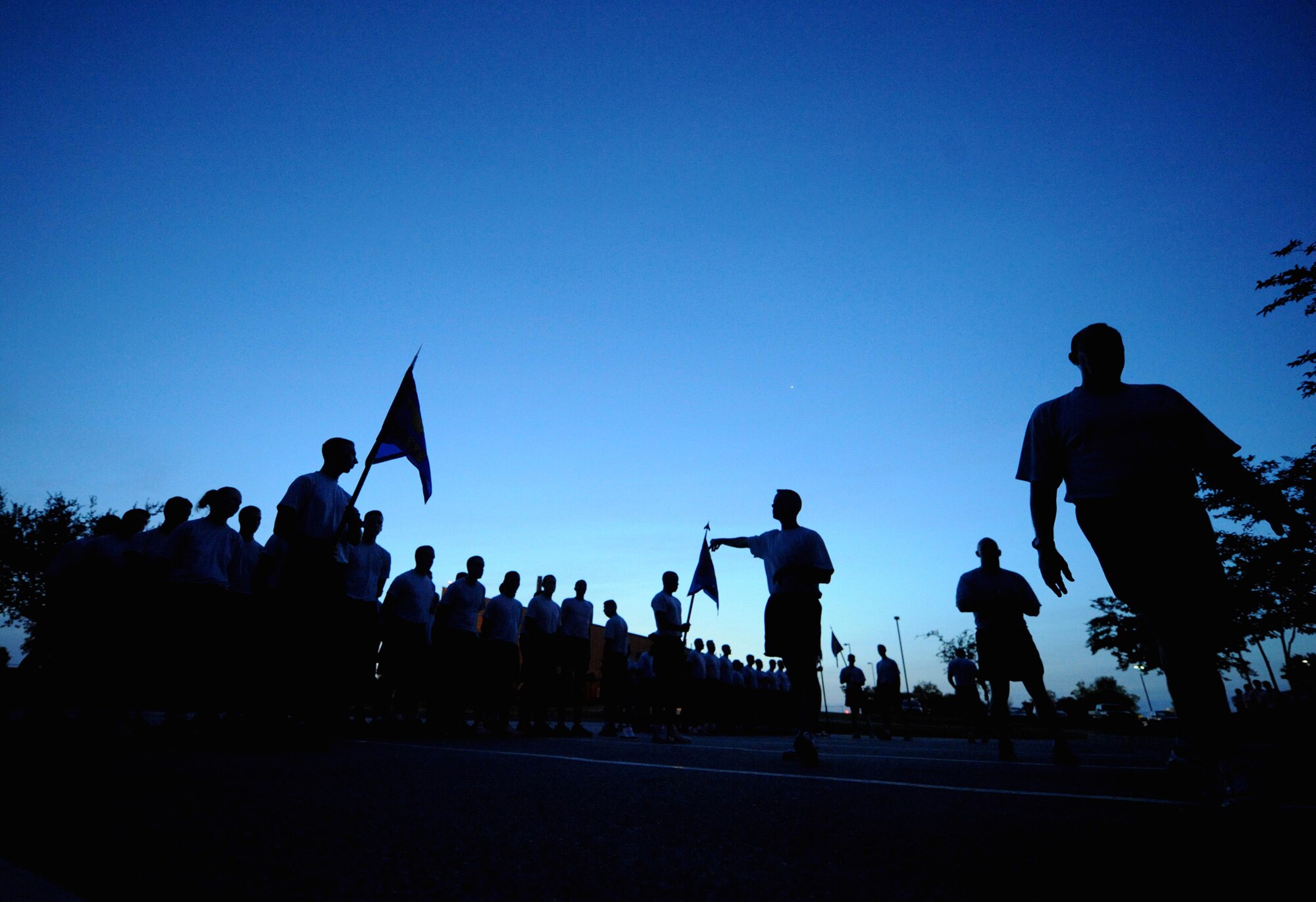 MOODY AIR FORCE BASE, Ga. -- 93rd Air Ground Operations Wing Airmen form up in the early morning July 30 here prior to participating in a two-mile formation run. The Airmen ran with Brig. Gen. Michael Longoria, 93rd AGOW commander, for the last time before his change of command ceremony held on July 31. (U.S. Air Force photo by Senior Airman Gina Chiaverotti-Paige)