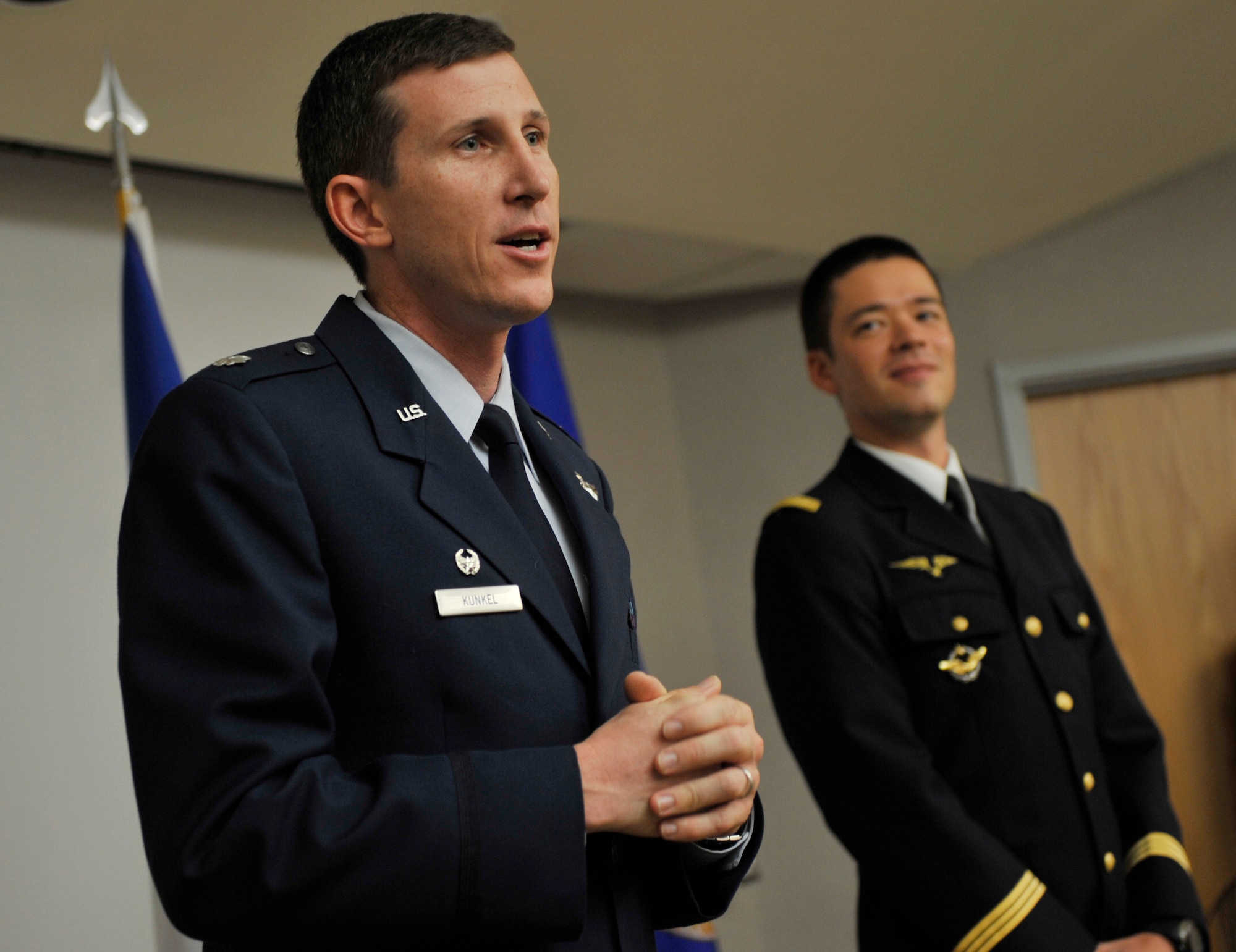 MOODY AIR FORCE BASE, Ga. -- Lt. Col. Thomas Kunkel, 41st Rescue Squadron commander, speaks to the audience here July 31, during a promotion ceremony held for Capt. Guillaume Vernet, an HH-60G PaveHawk pilot assigned to the 41st RQS. Captain Vernet is a French pilot and is a part of a three-year officer exchange program. (U.S. Air Force photo by Senior Airman Schelli Jones)